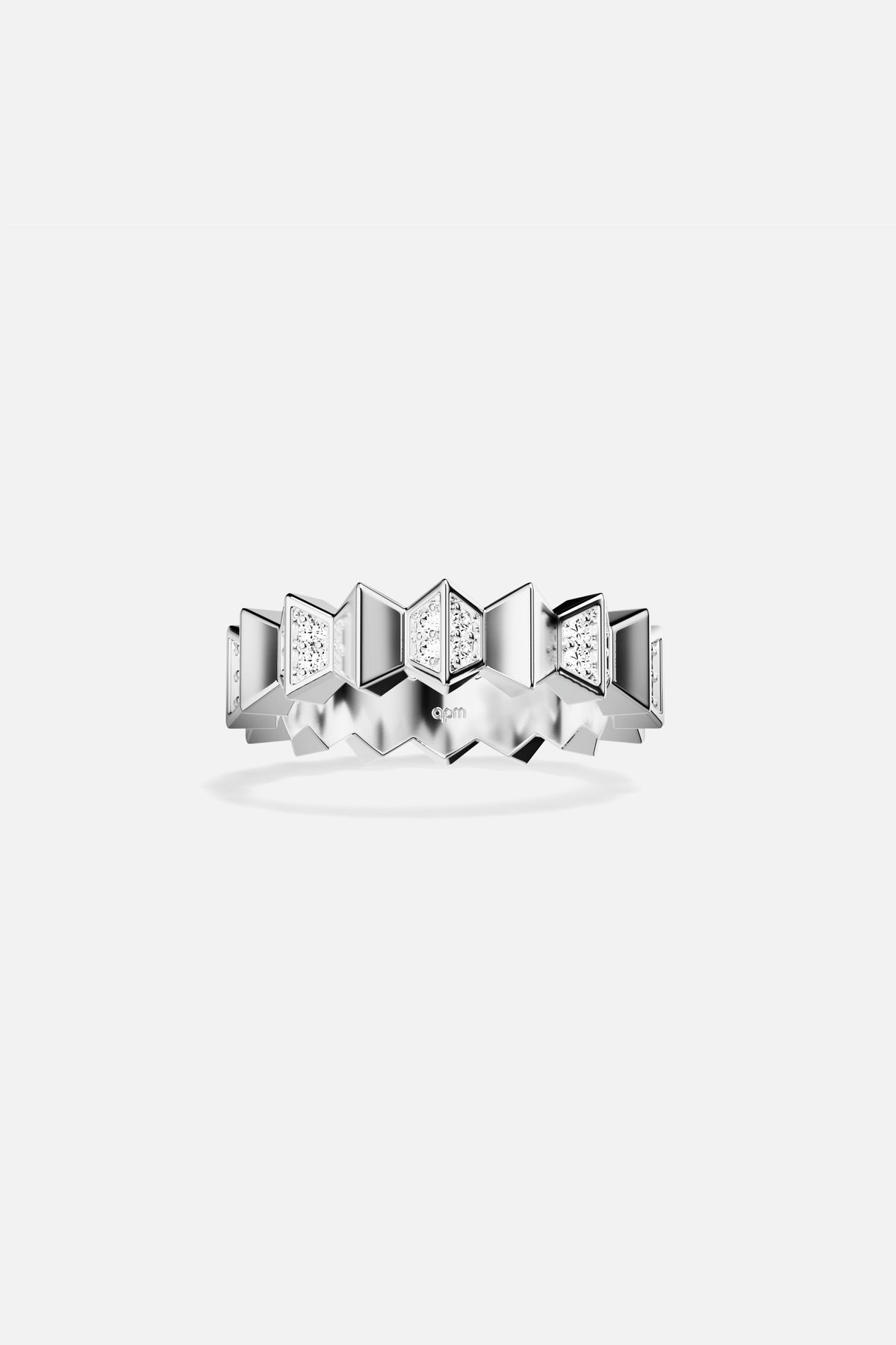 APM Ring, geometric peaks in rhodium finish, sharp and quietly radiant.