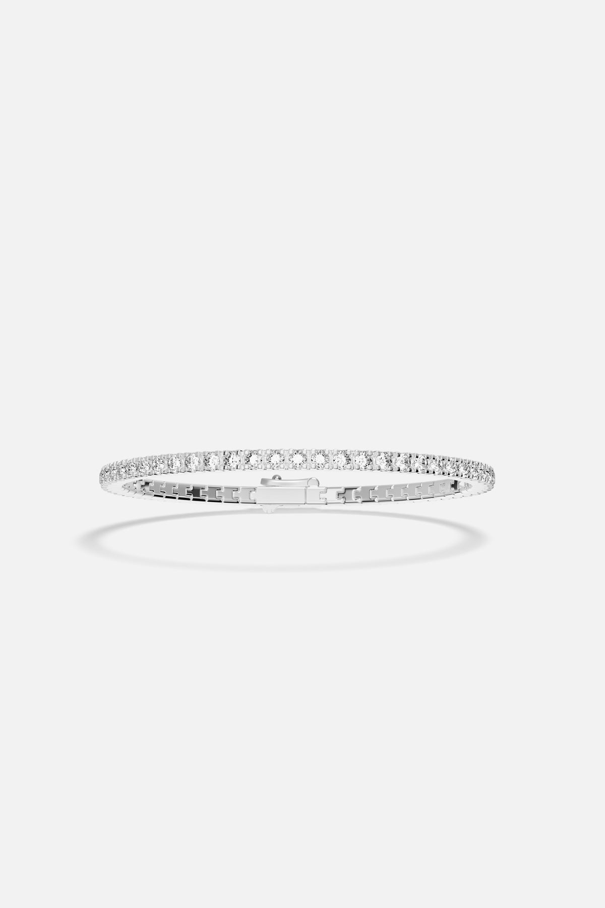 APM Tennis Bracelet in rhodium finish, a timeless sparkle for effortless elegance.