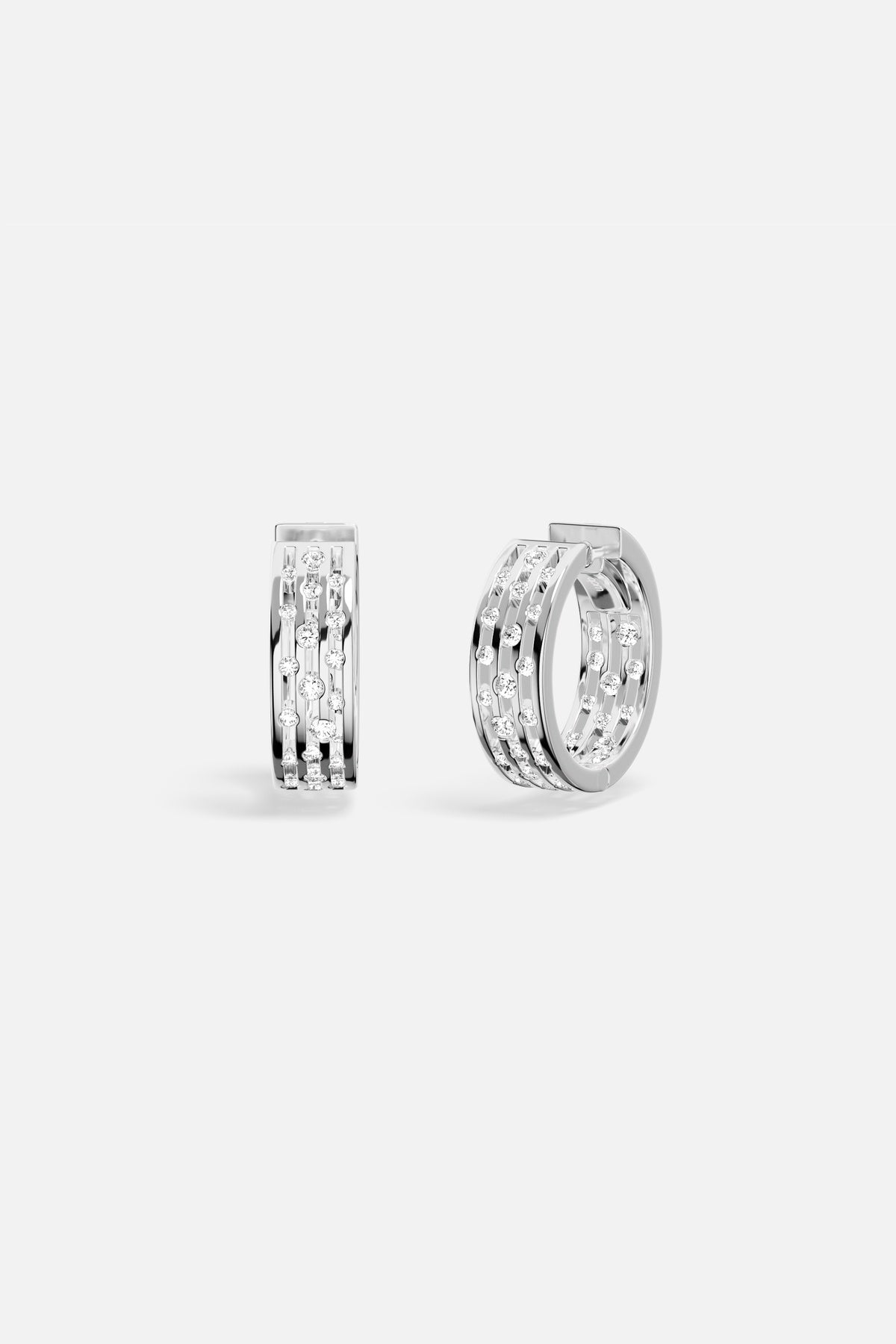 APM Hoop Earrings, a luminous rhythm in rhodium finish, effortlessly modern.