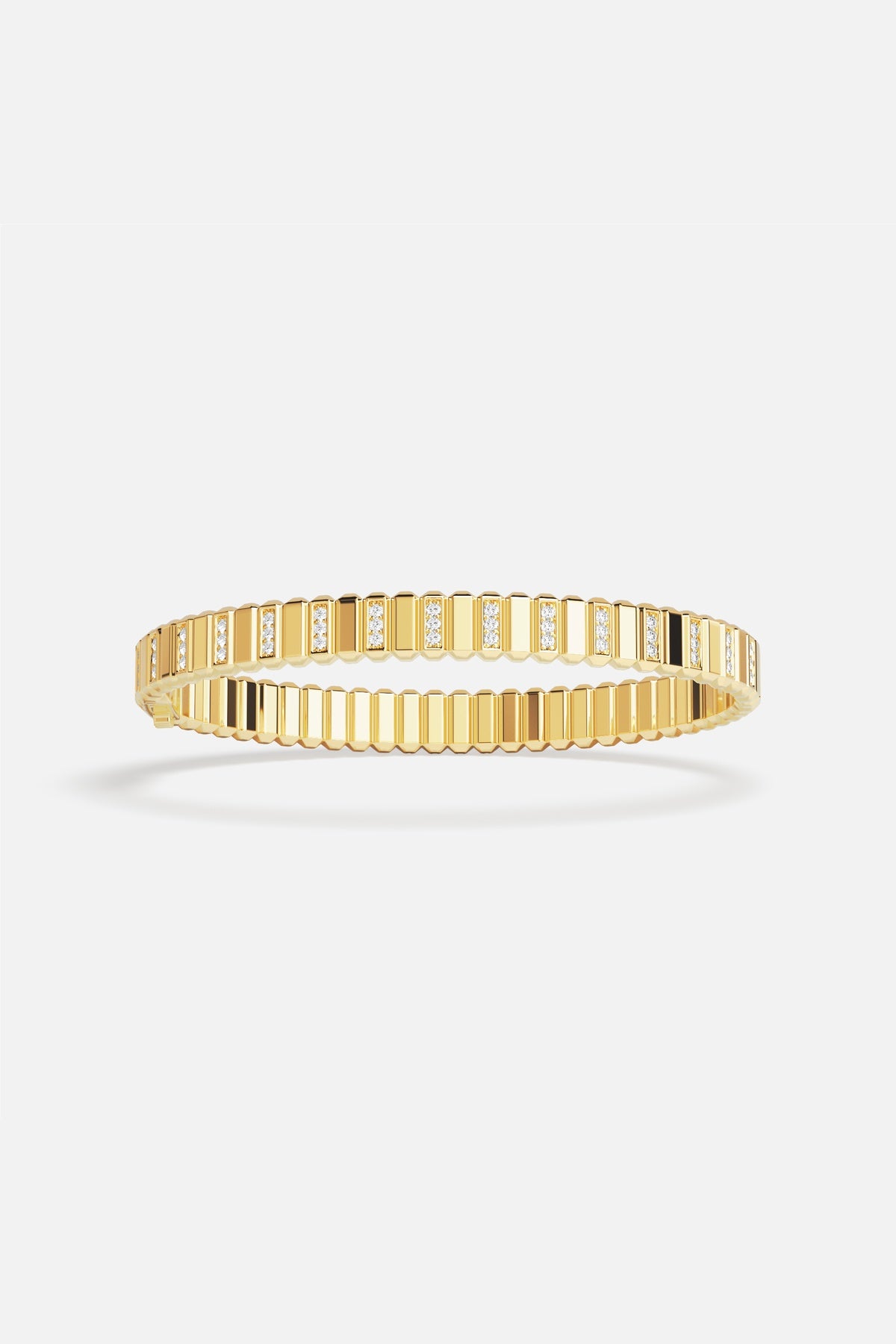 APM Monaco ribbed bangle in golden color, radiant modern elegance with a refined shimmer.