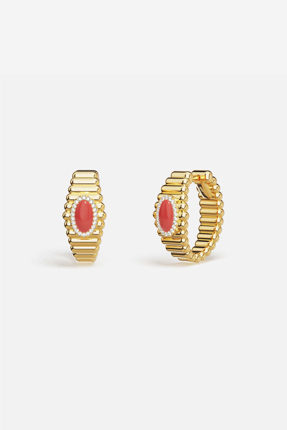 APM Hoop Earrings in golden ridges, crowned with a coral glow.