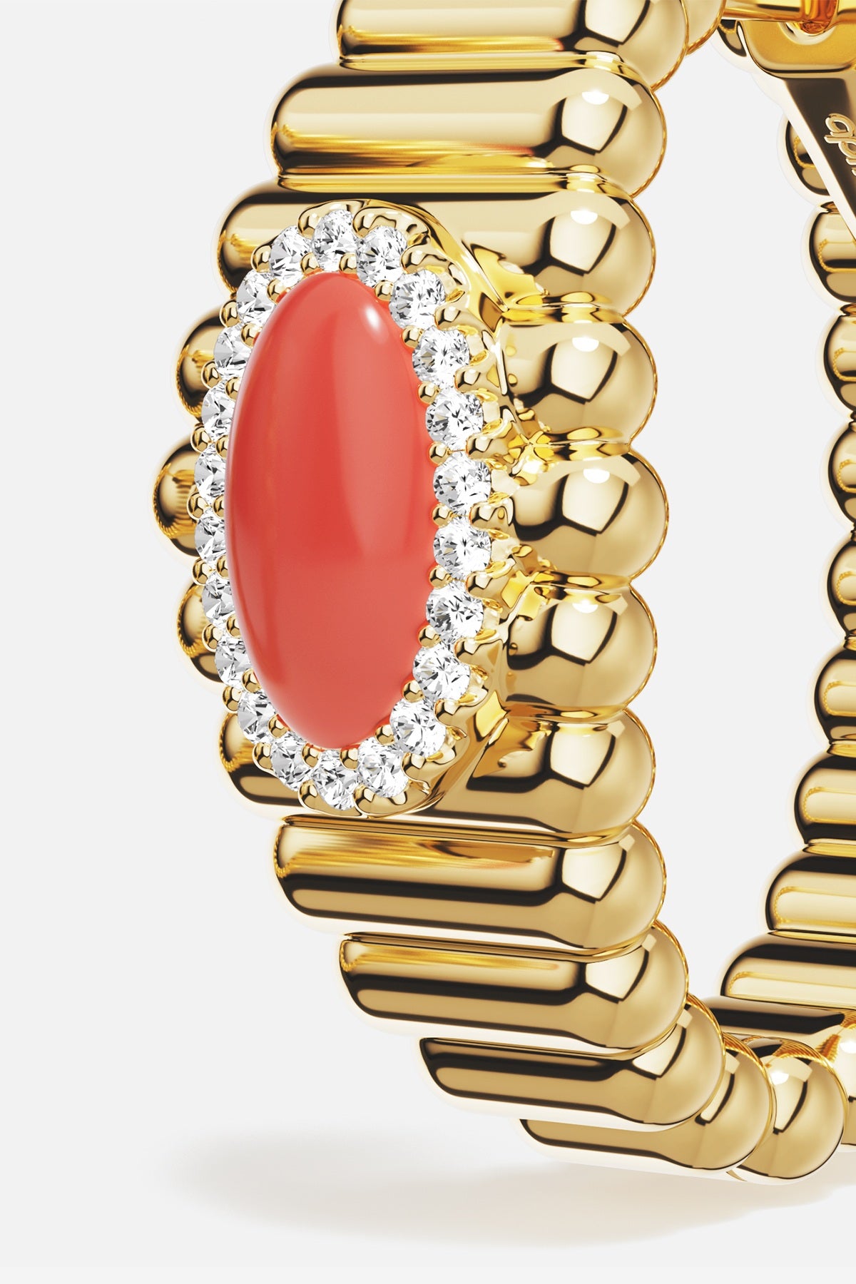 APM Ring in golden hue, a coral glow wrapped in radiant sparkle.