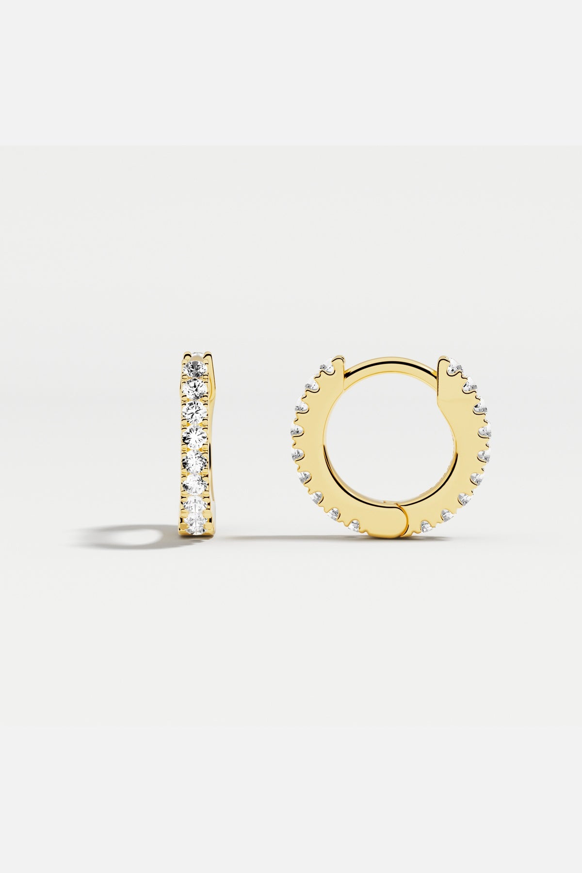APM Hoop Earrings, a golden shimmer for effortless everyday elegance.