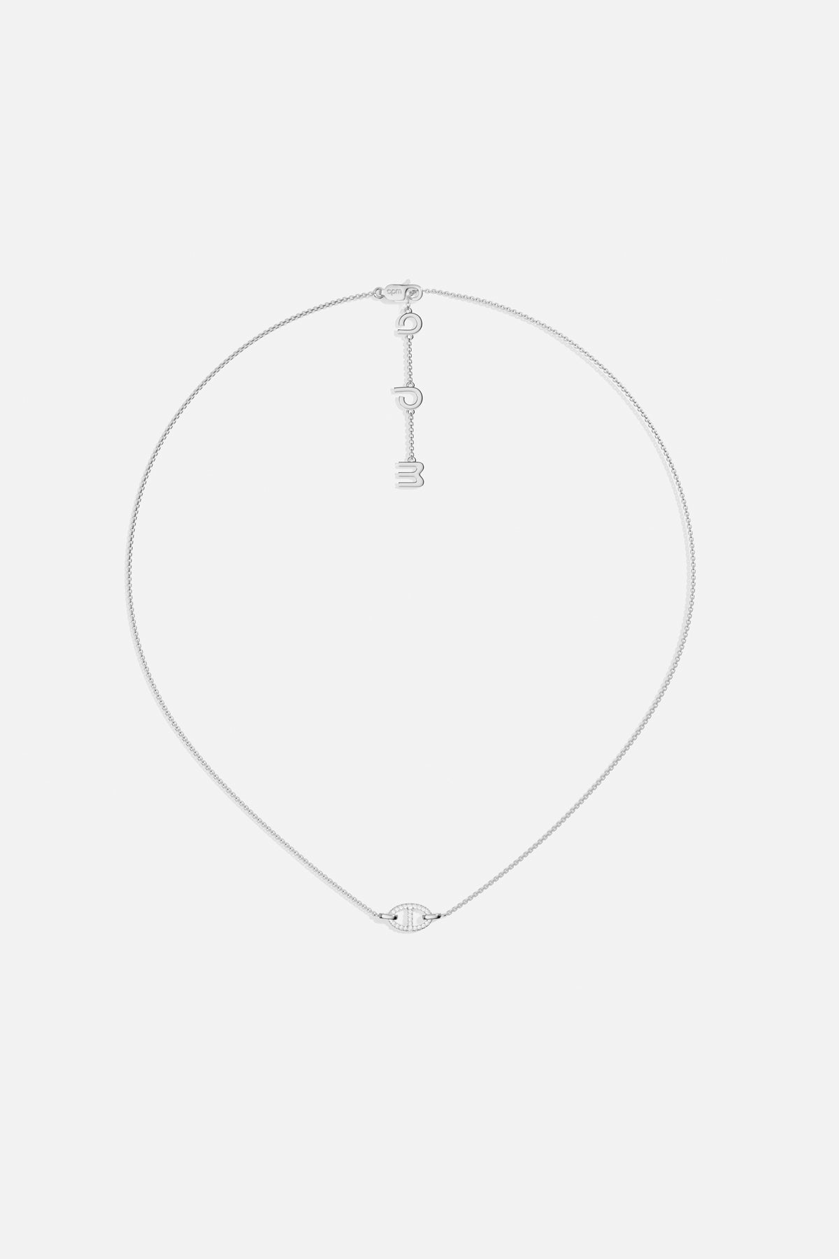 APM Necklace in rhodium finish, a delicate charm poised with quiet modern elegance.