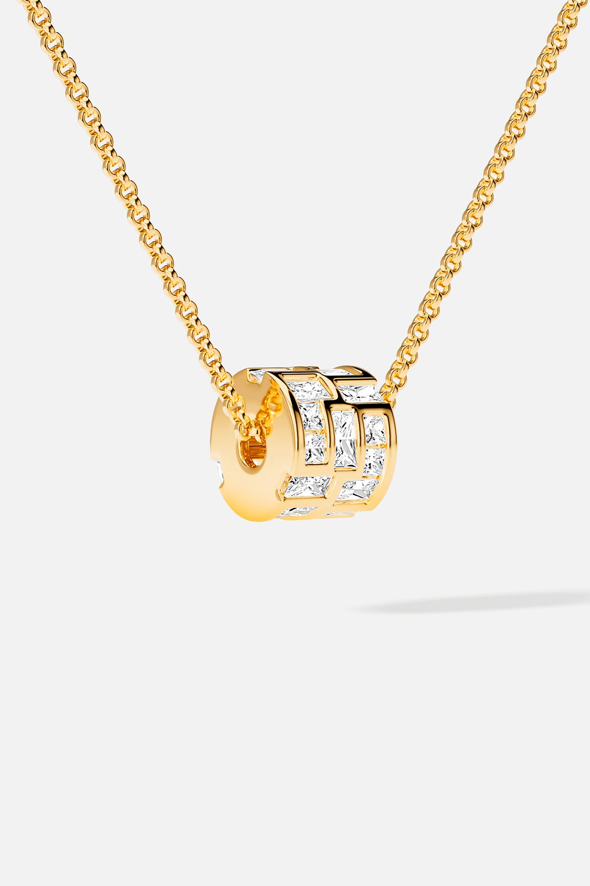APM Necklace in golden hue, a luminous charm of modern elegance.