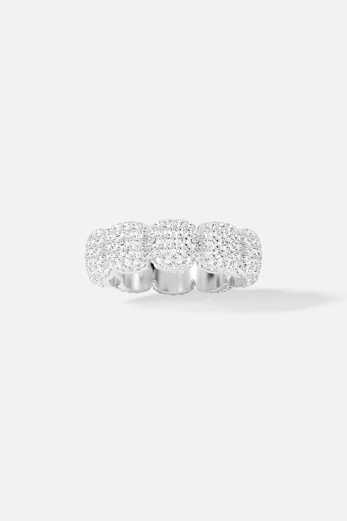 APM MONACO silver ring with embedded white stones on a white background
