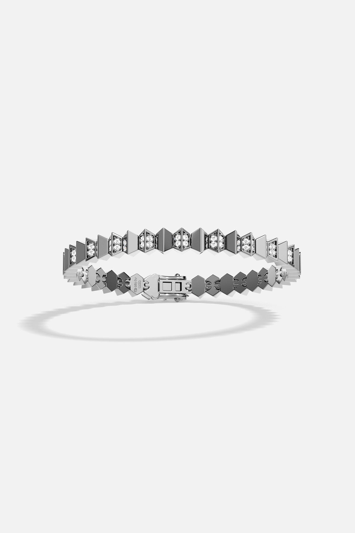 Dark grey silver bracelet with geometric design on a white background
