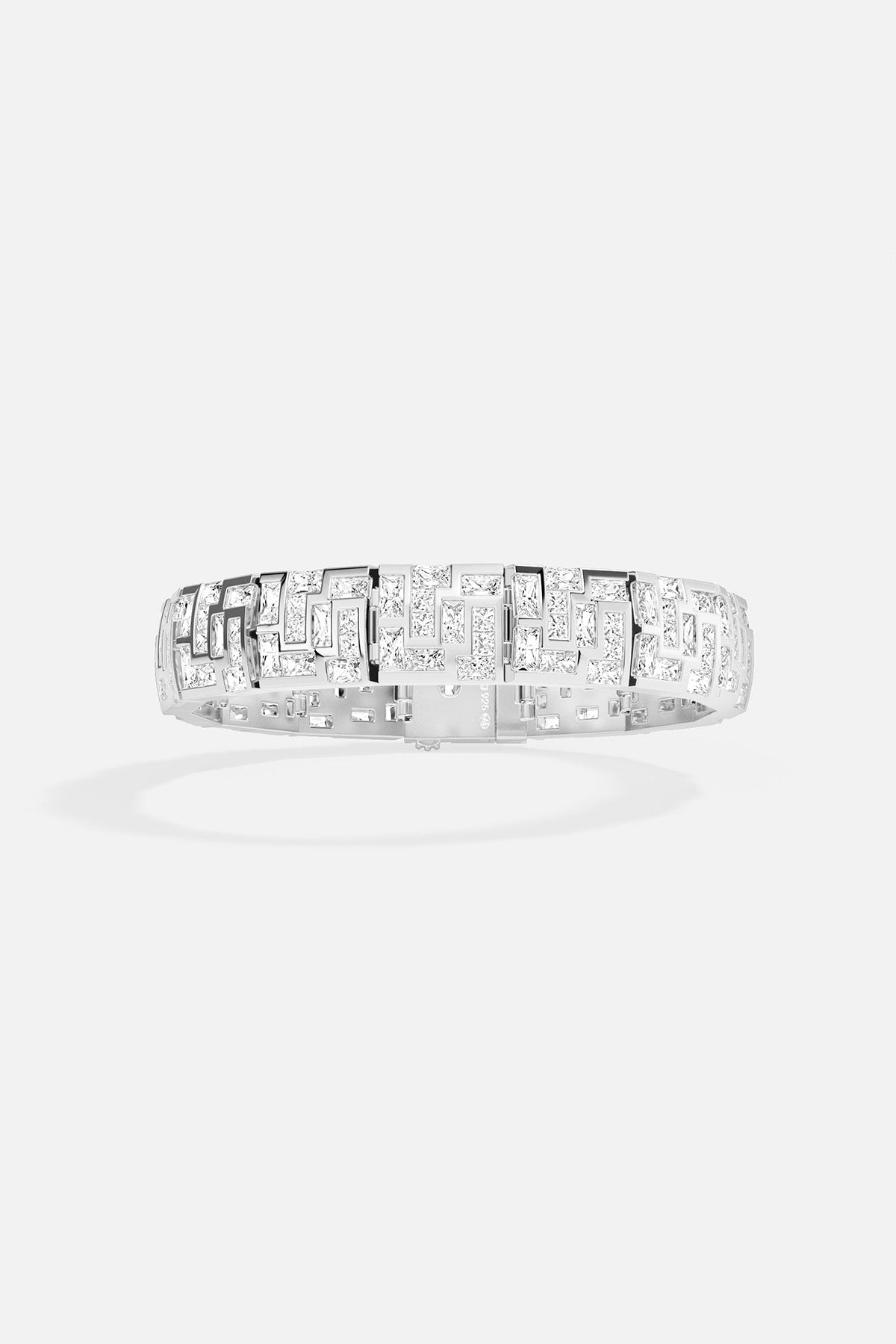 APM MONACO chunky labyrinth bracelet in silver with rectangular stones on a light gray background