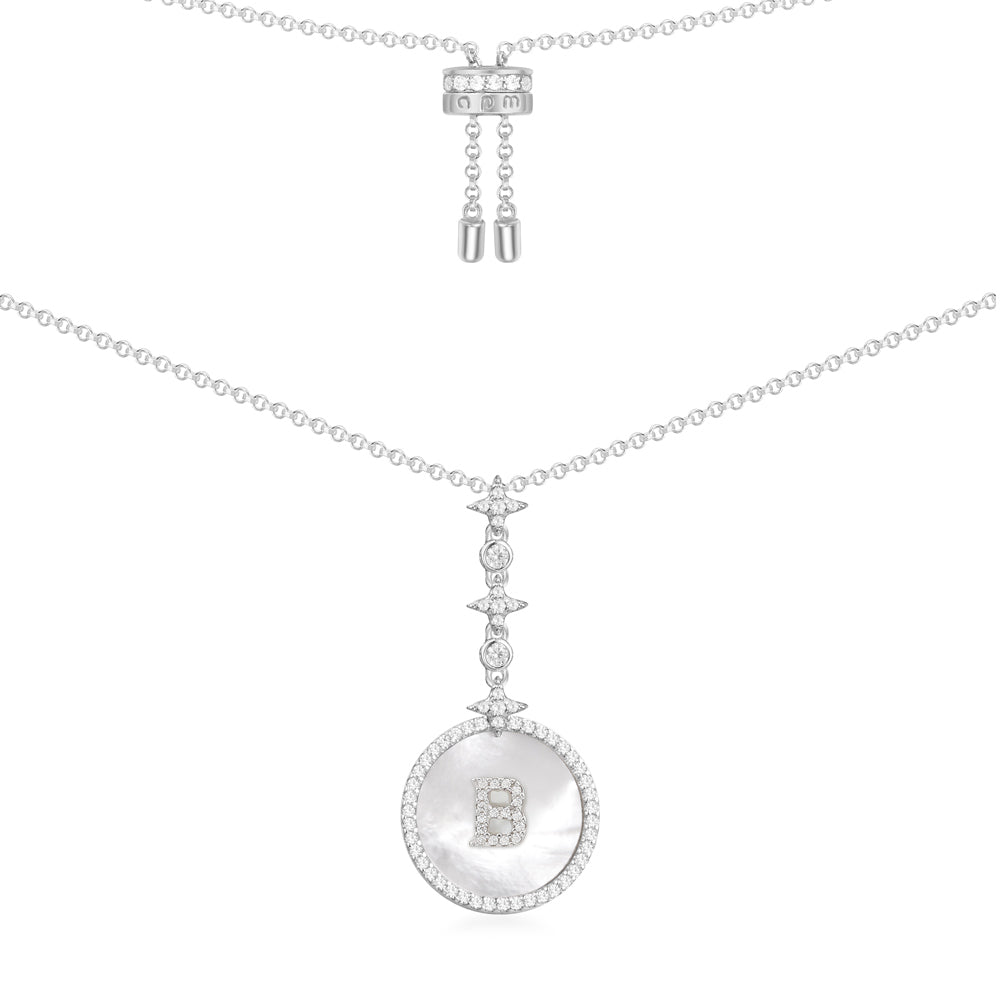 Necklaces APM Monaco, white-tone silver chain necklace with a circular pendant featuring a cutout letter B.