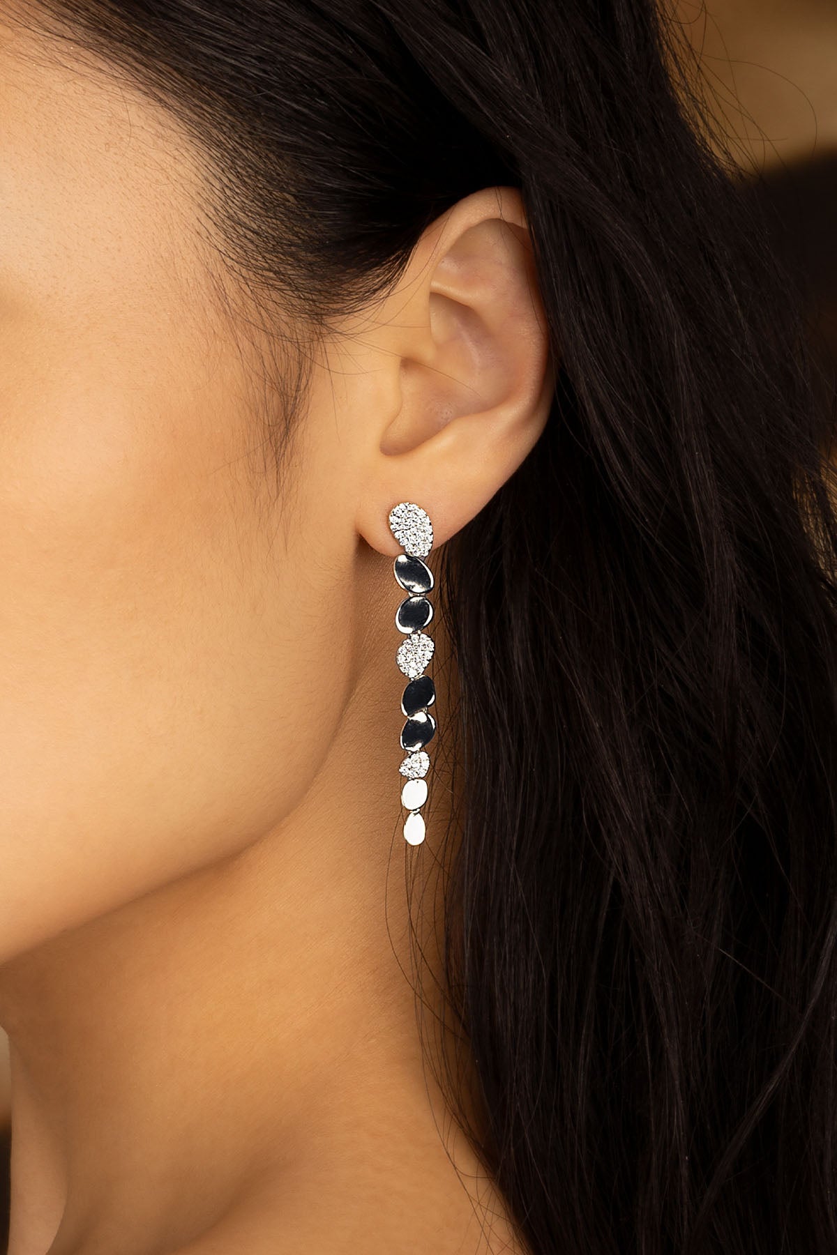 Earrings APM Monaco yellow gold galet drop with round diamond accents.