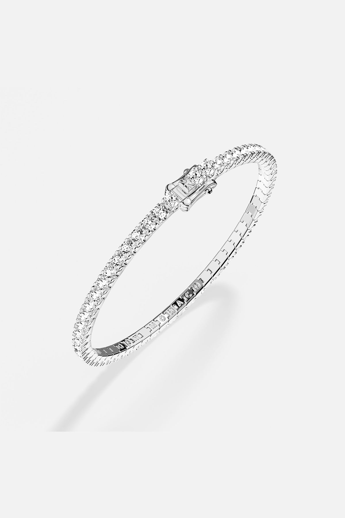 Bracelets APM Monaco pavé white stones on a silver-tone bracelet.