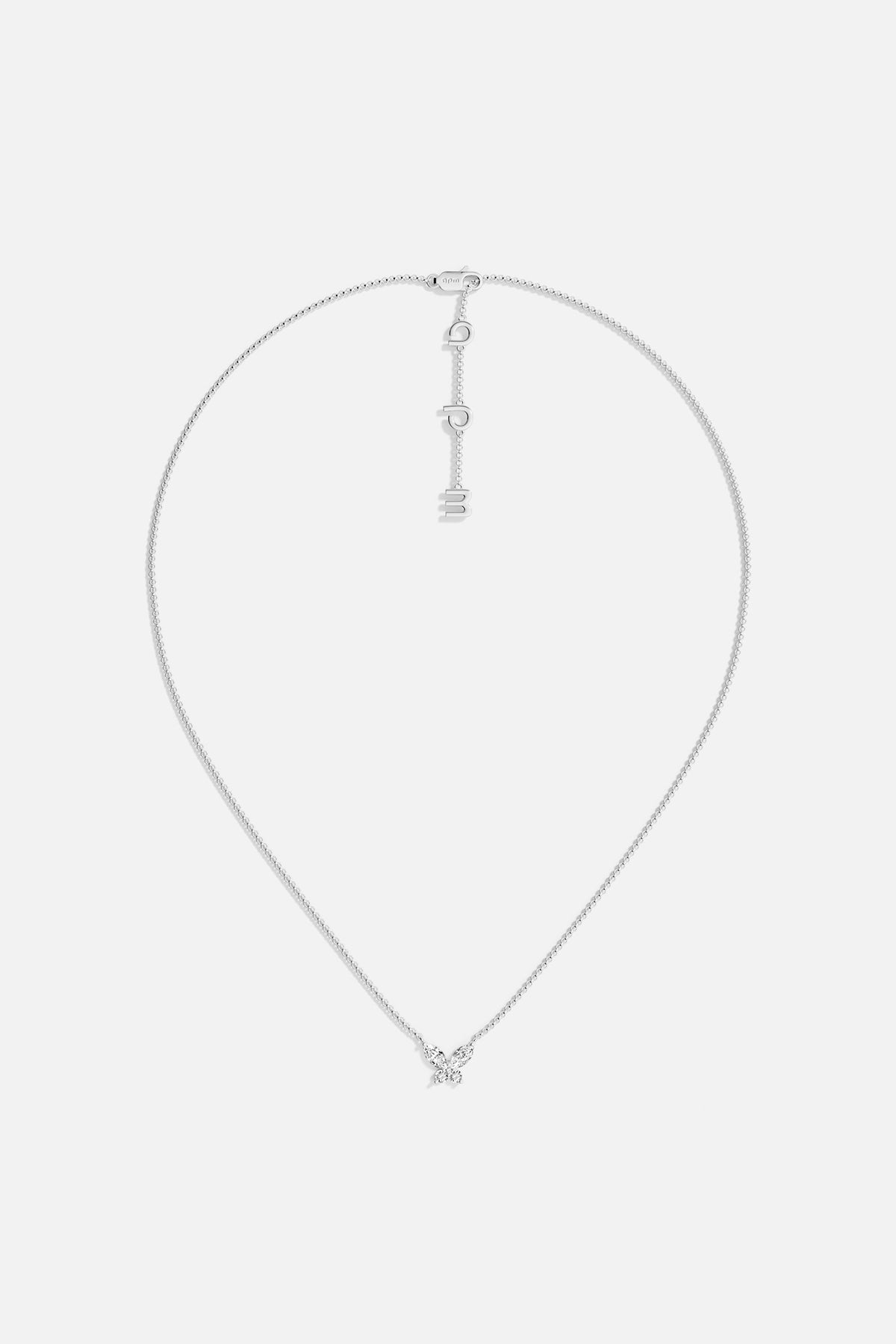 Necklaces APM Monaco. White gold butterfly necklace with white cubic zirconia on a Silver-tone chain; butterfly pendant and APM clasp.