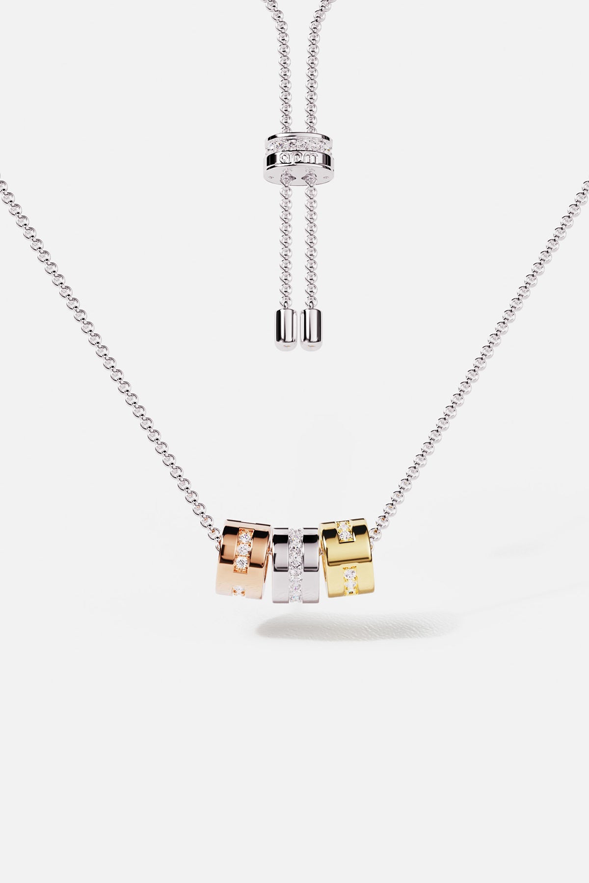 Necklaces APM Monaco adjustable morse-code necklace with three square rhinestone pendants in gold, Silver-tone, and pink tones.
