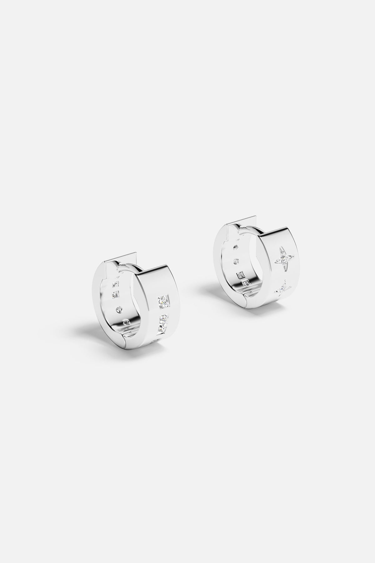 The bak of APM Monaco white-silver-toned huggie earrings with cubic zirconia