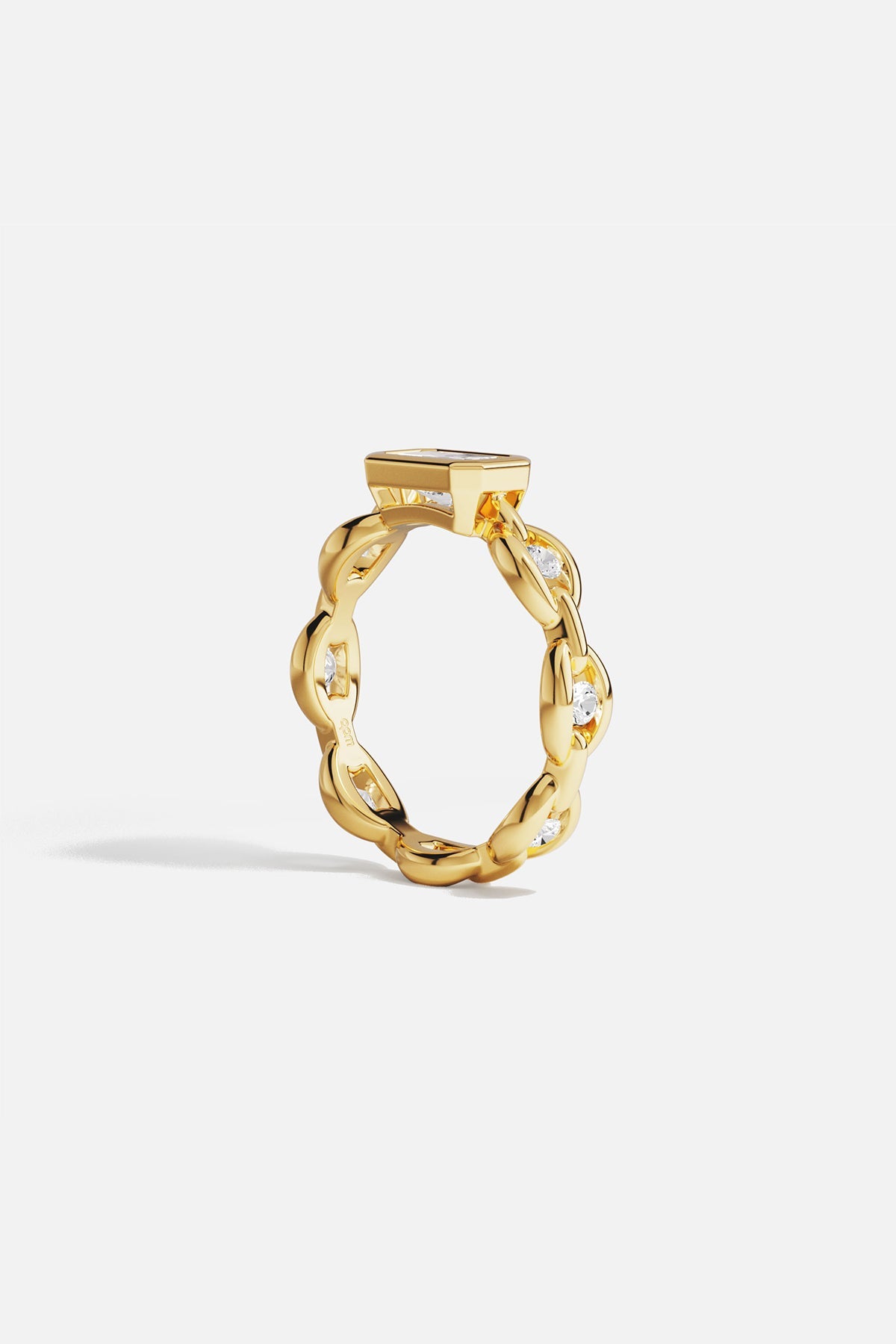 Rings APM Monaco yellow gold chain ring featuring a large rectangular clear stone.