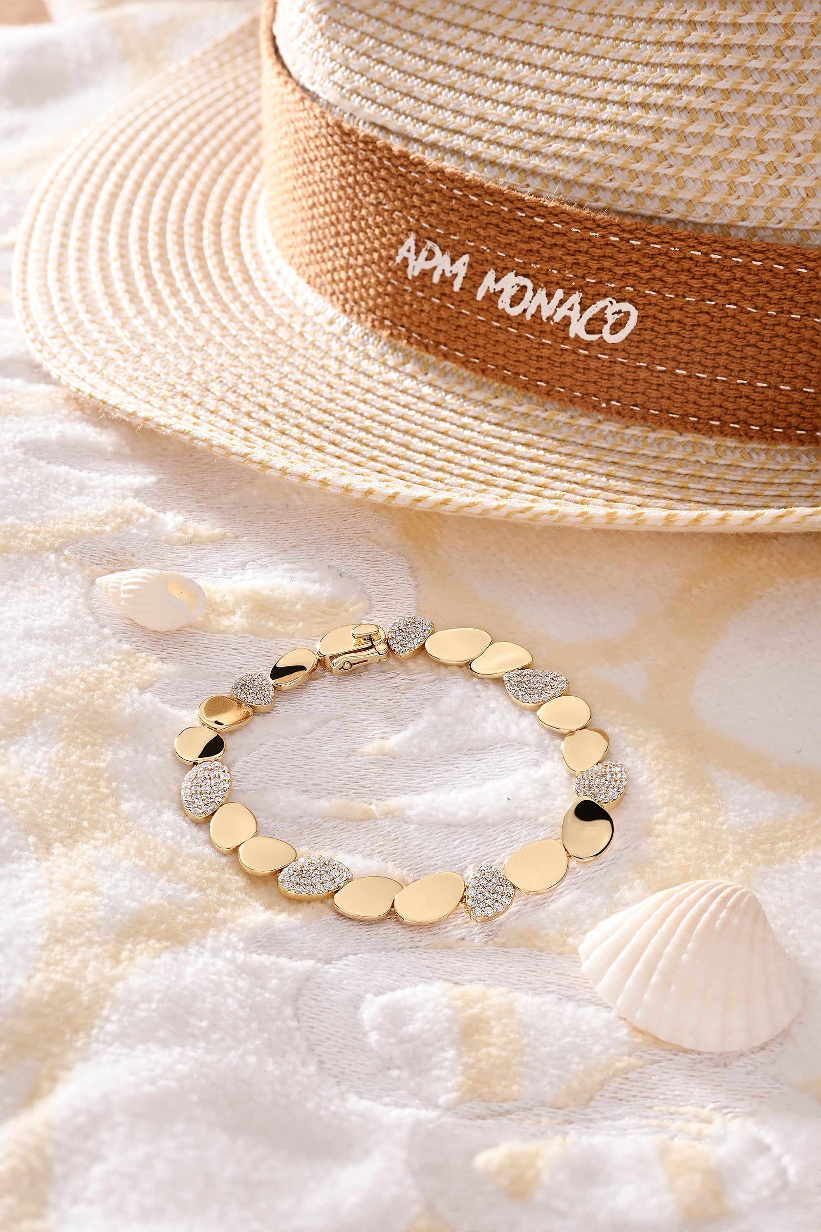 Bracelets APM Monaco round galet bracelet with pave stones.
