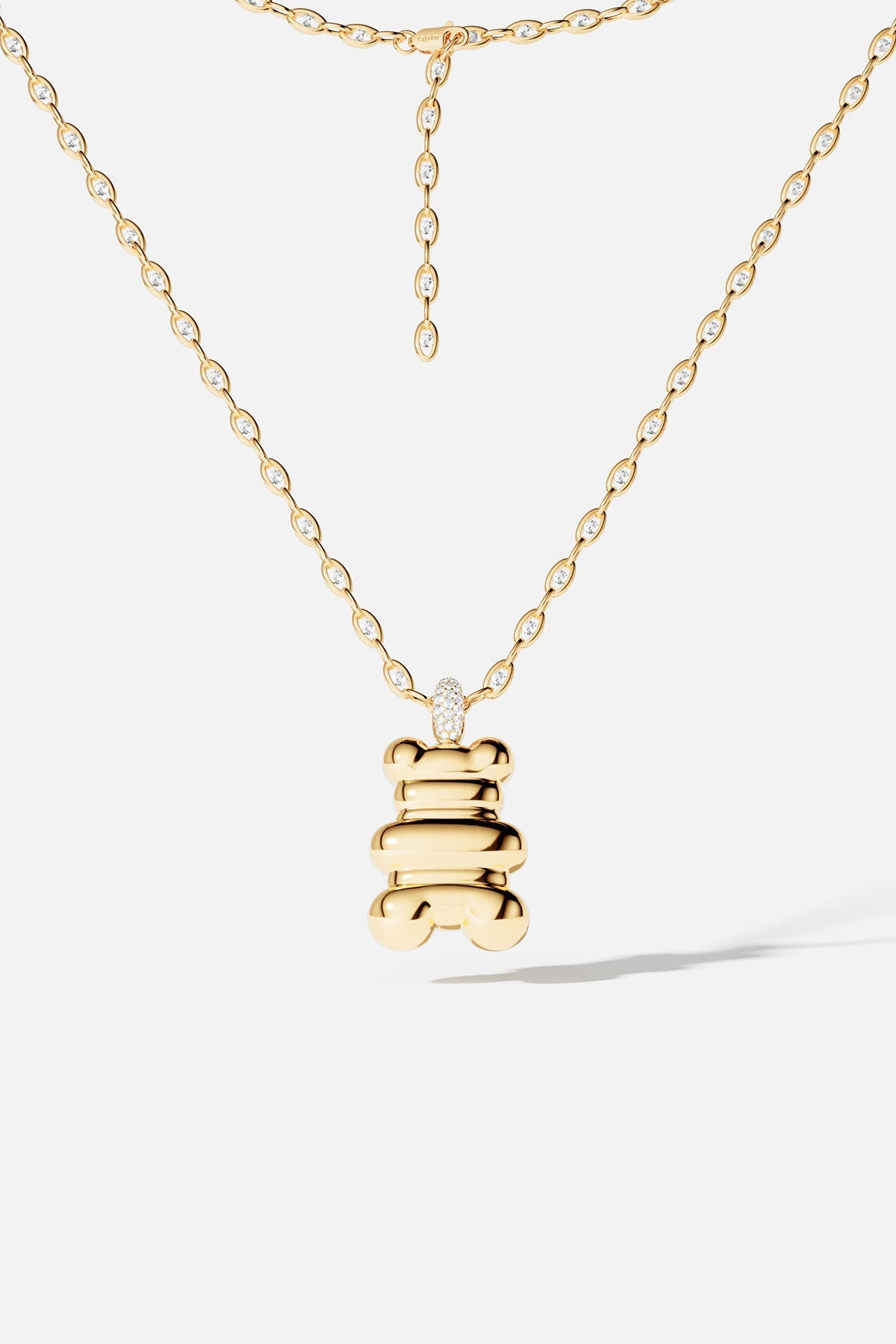 Necklaces APM Monaco: yellow gold chain necklace with diamond accents and a bear pendant.