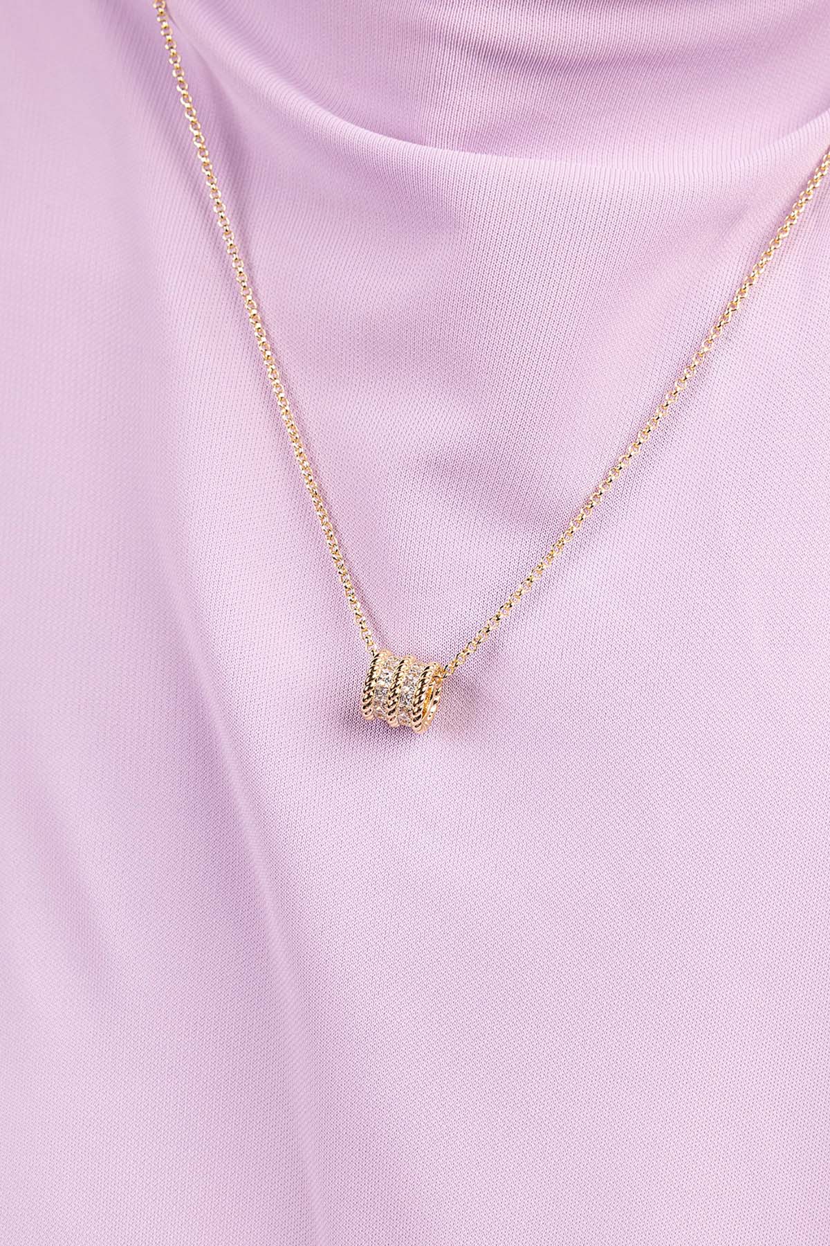 APM MONACO yellow gold torsade adjustable necklace with white stones on purple top