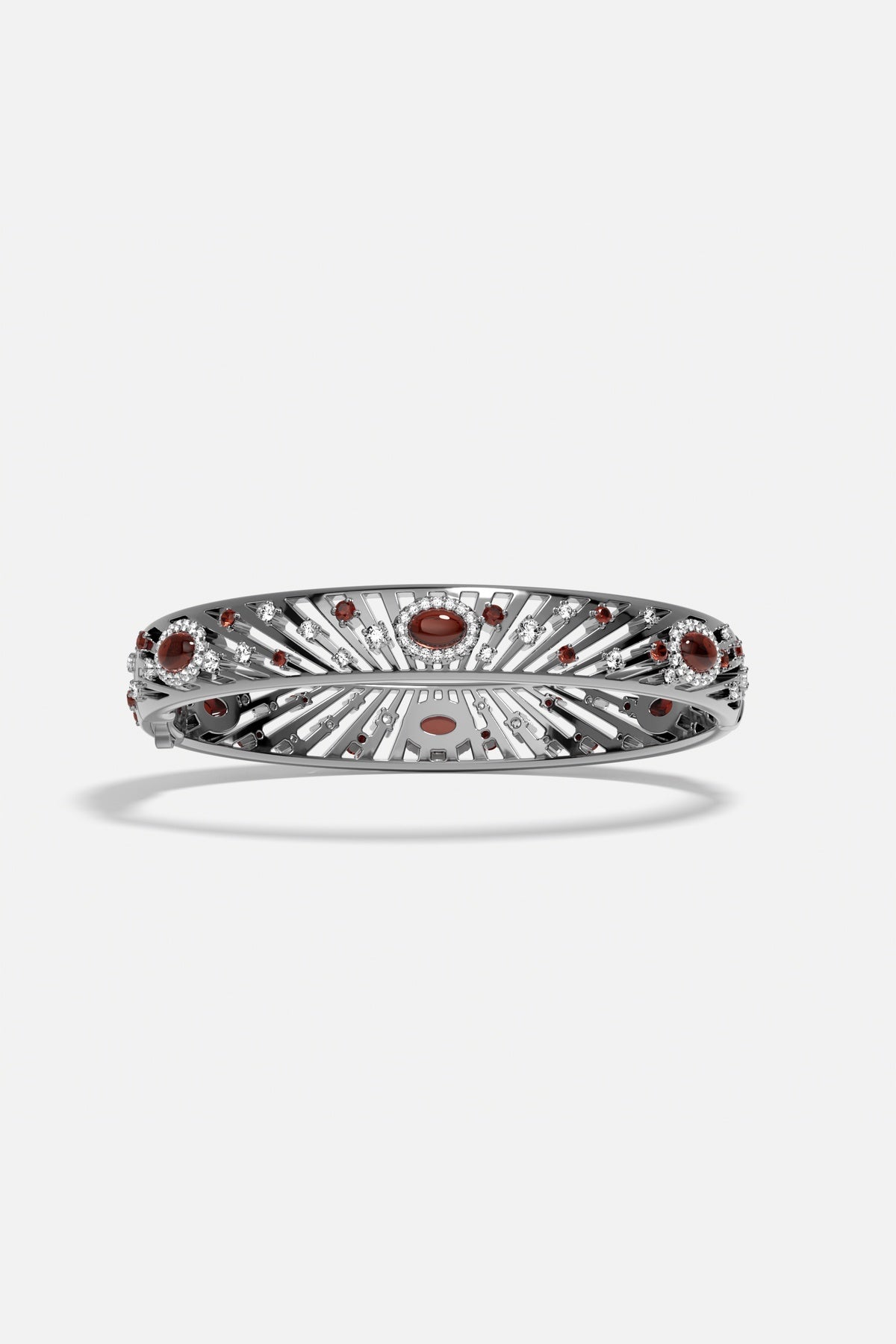 APM Bangle in rhodium finish with radiant red stones, a bold statement of elegance.