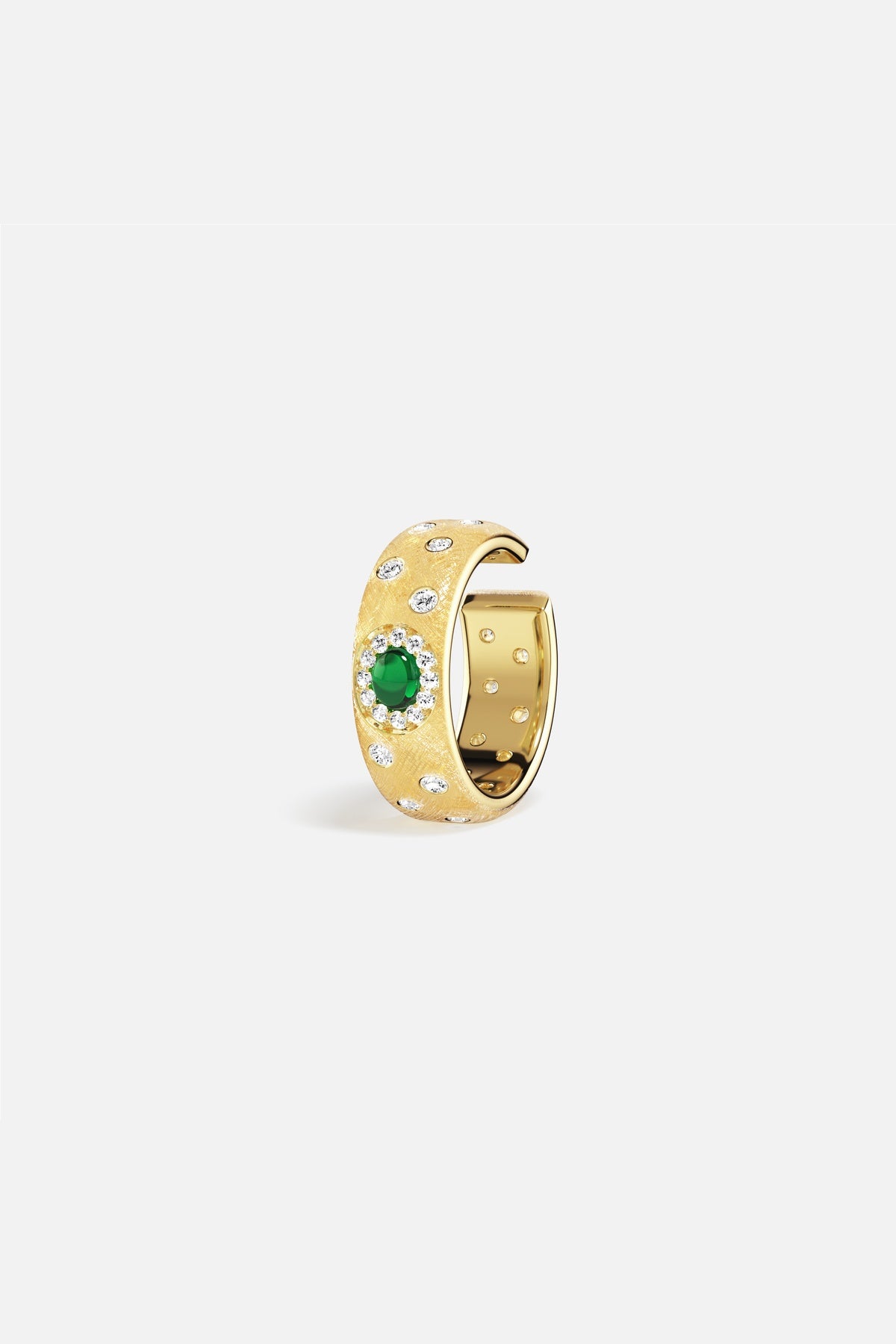 APM Ear Cuff in golden hue, a green spark of quiet elegance.