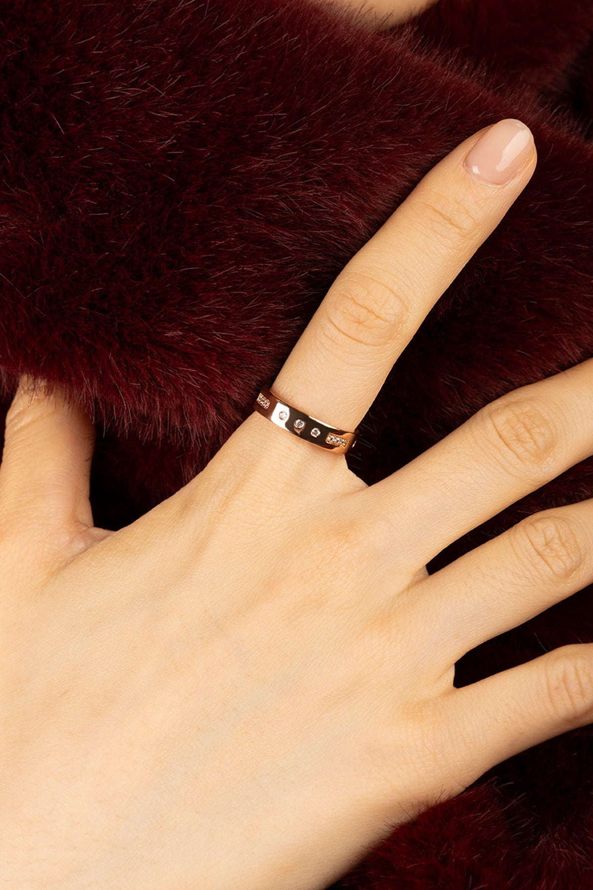 Woman wearing APM Morse Ring, a whisper of code in warm rose.