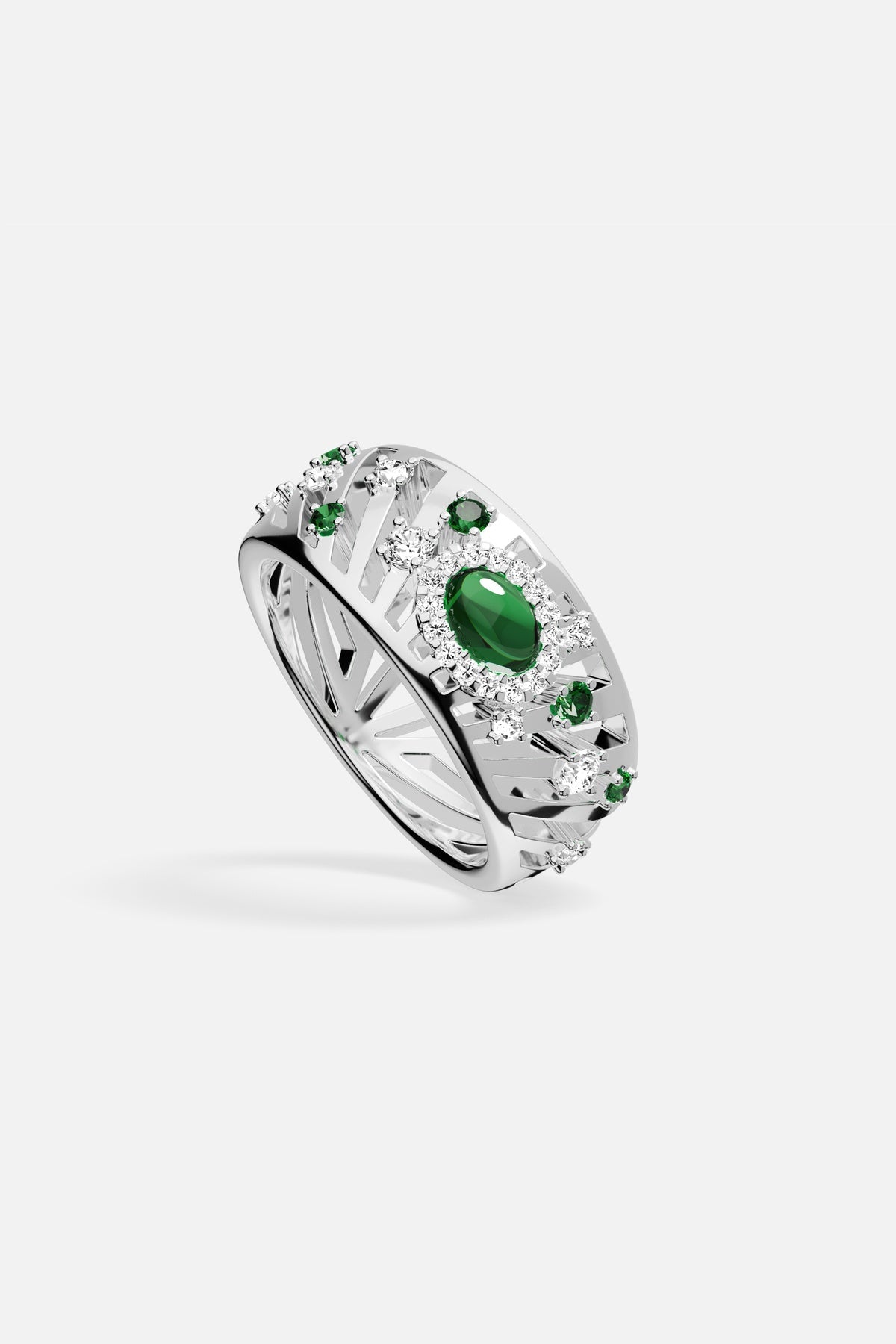 APM Ring in rhodium finish, green stones glowing with quiet, radiant elegance.