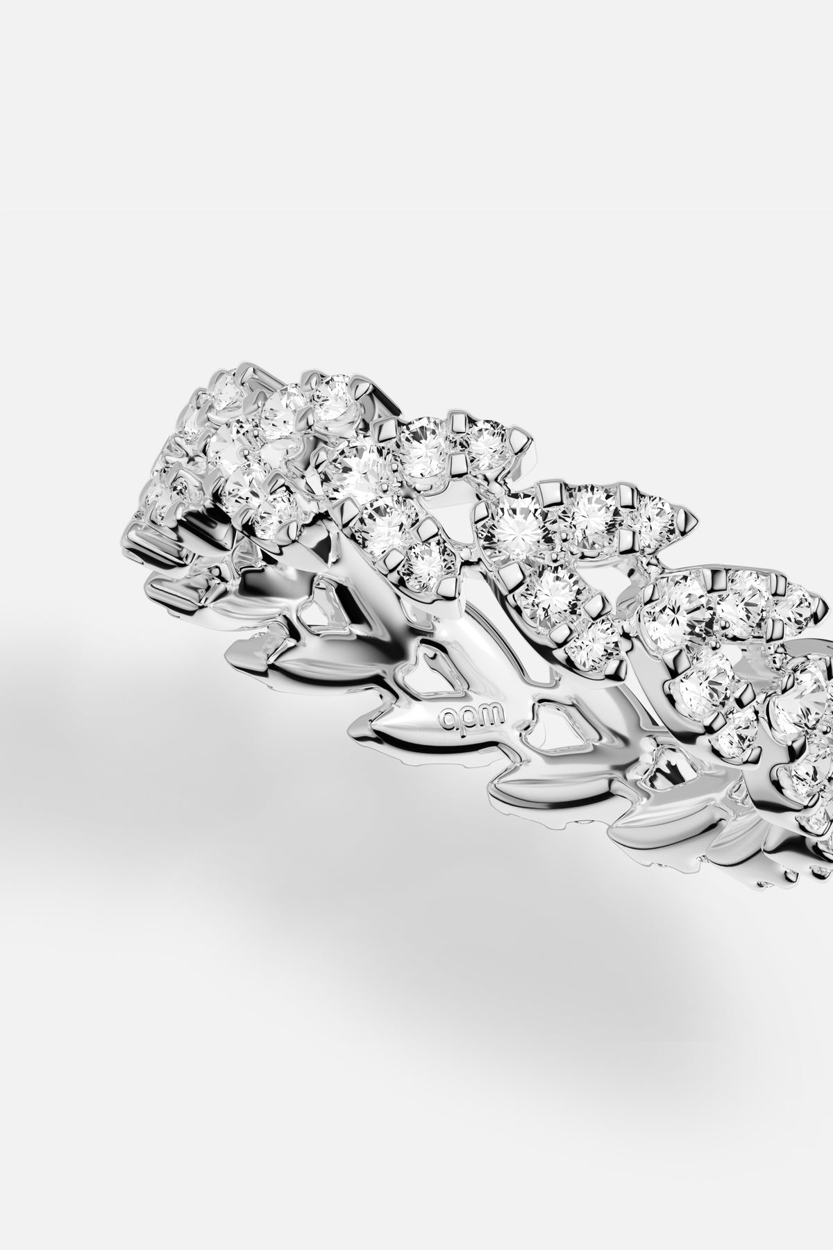 APM Ring in rhodium finish, a shimmering cascade of light and quiet allure.