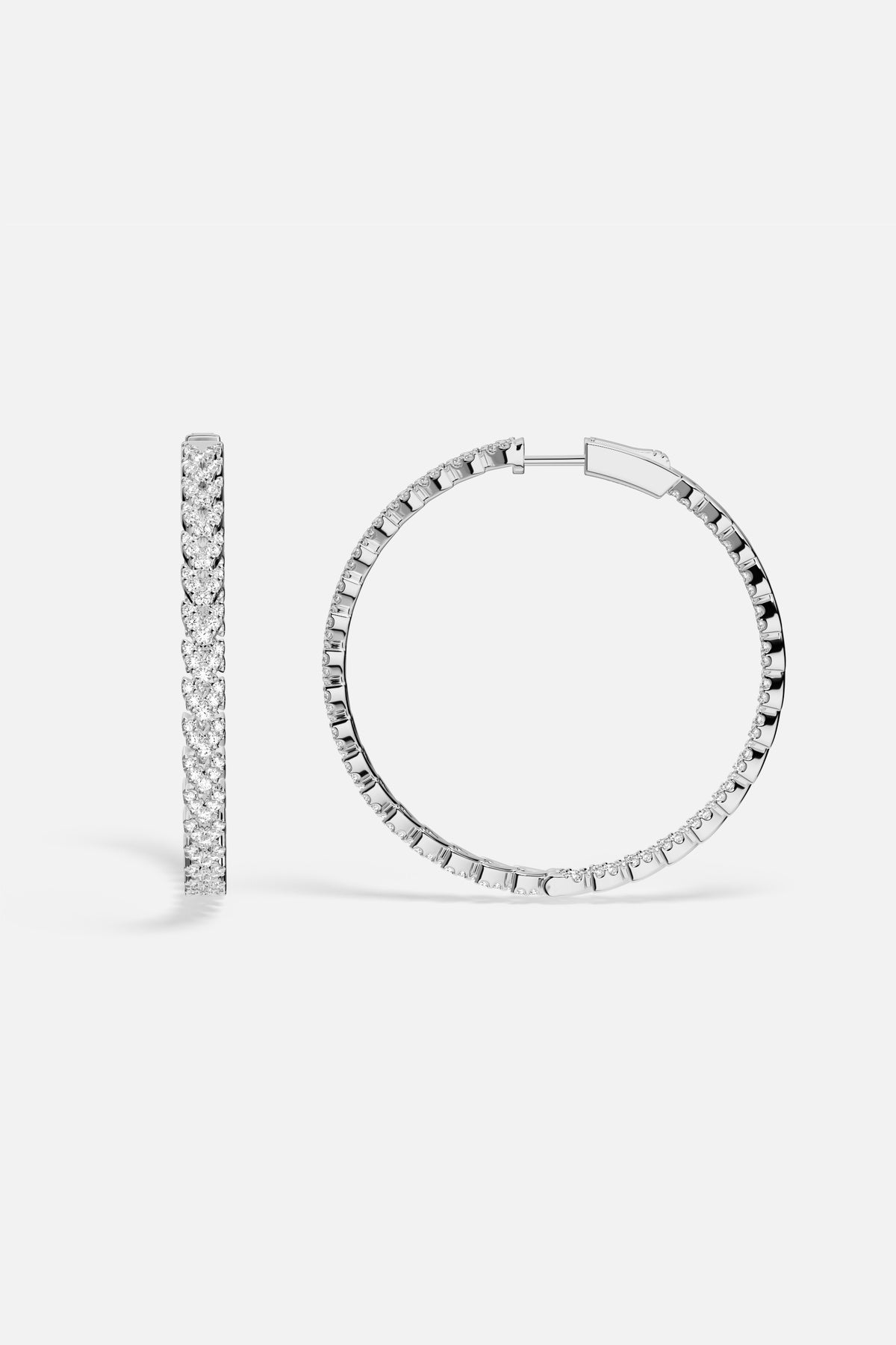 APM Hoop Earrings in rhodium finish, a luminous circle of effortless elegance.