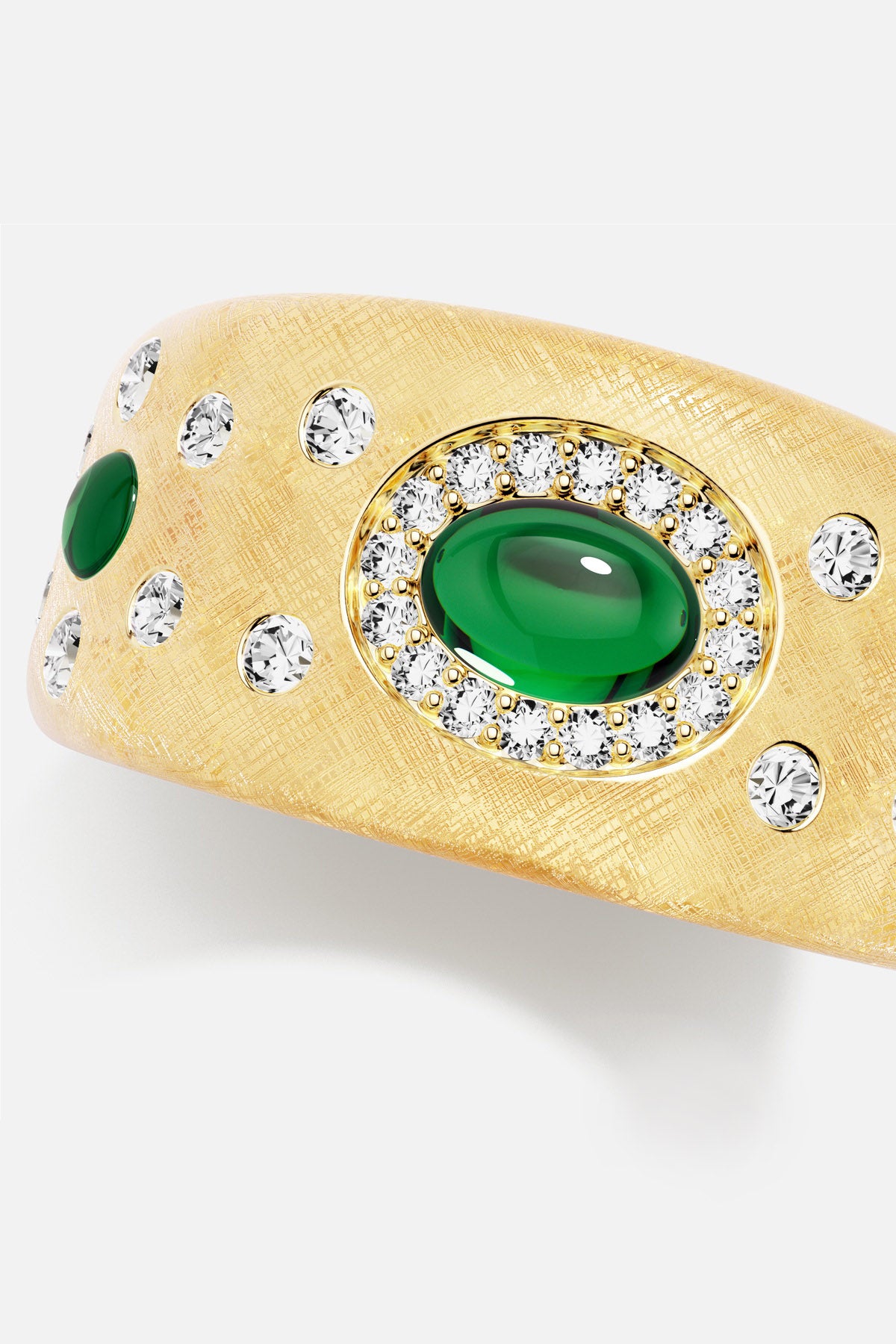 APM Ring in golden brushed finish, glowing with emerald green elegance.