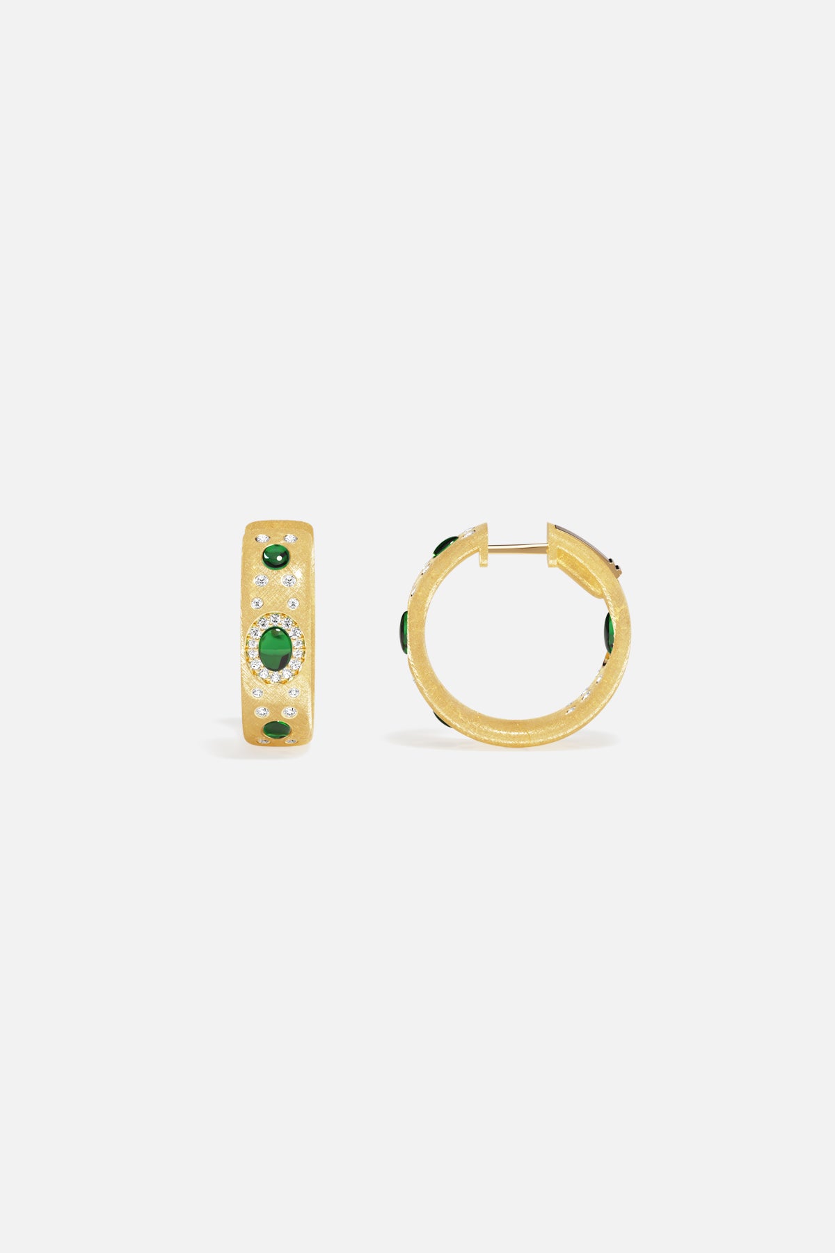 APM Hoop Earrings in golden hues, glowing with emerald green accents and quiet sparkle.