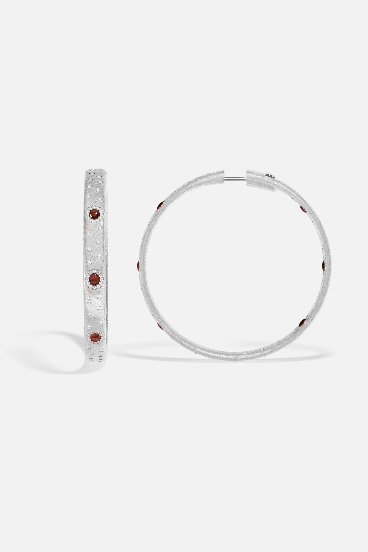 APM Hoop Earrings in rhodium finish, dotted with deep red accents, effortlessly radiant.