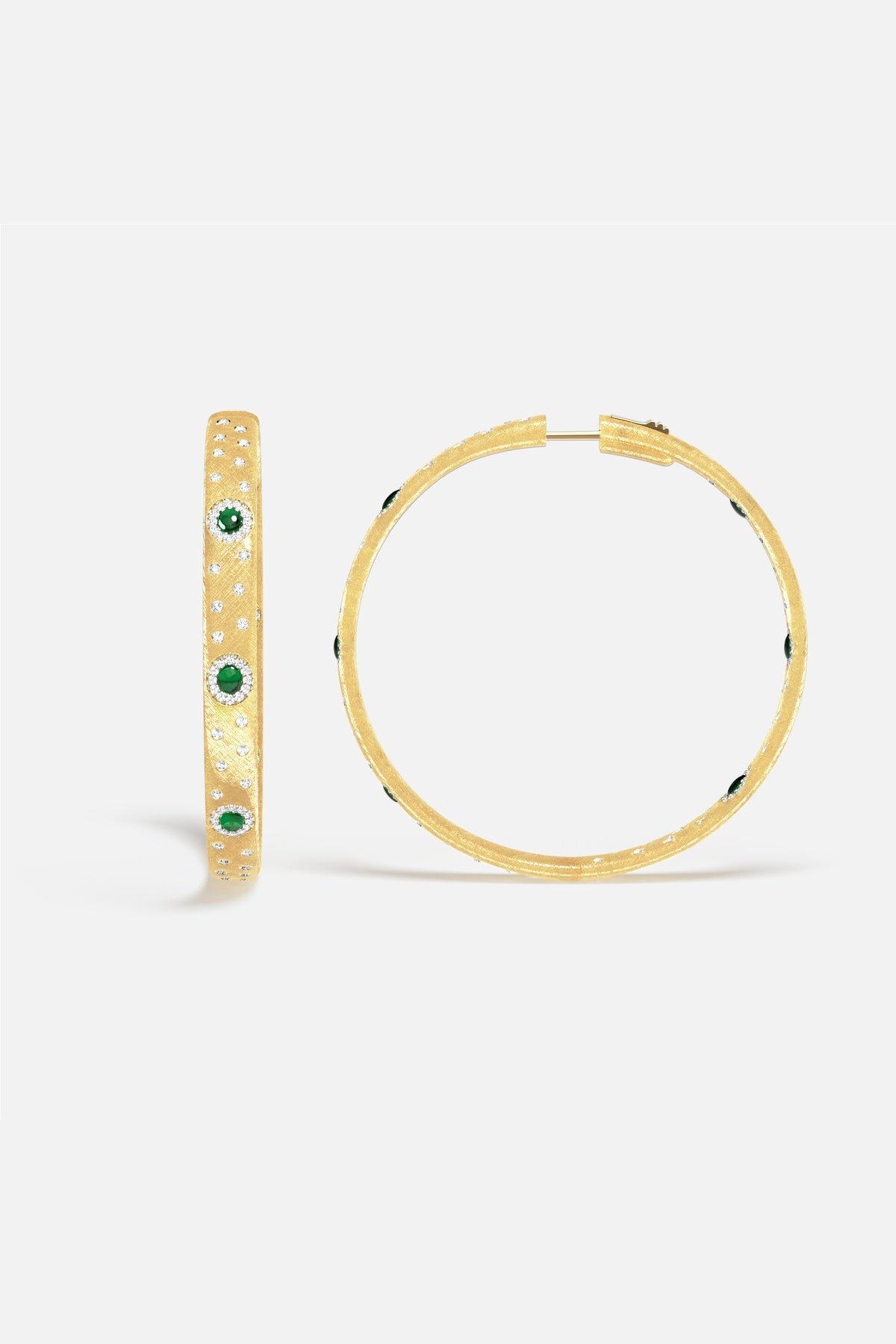 APM Hoop Earrings in golden hues, sparkling with emerald green accents and quiet elegance.
