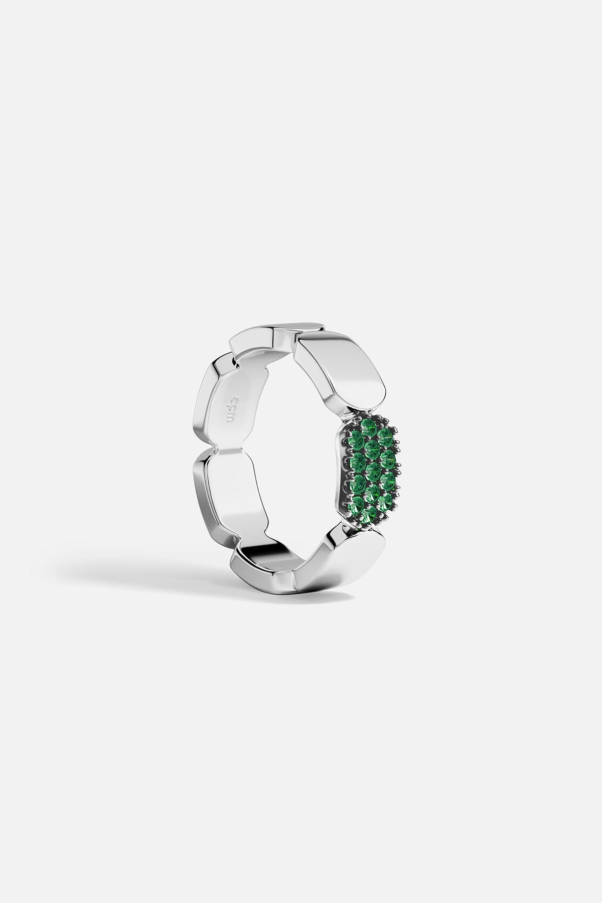 APM MOANCO white ring with green stones on a white background