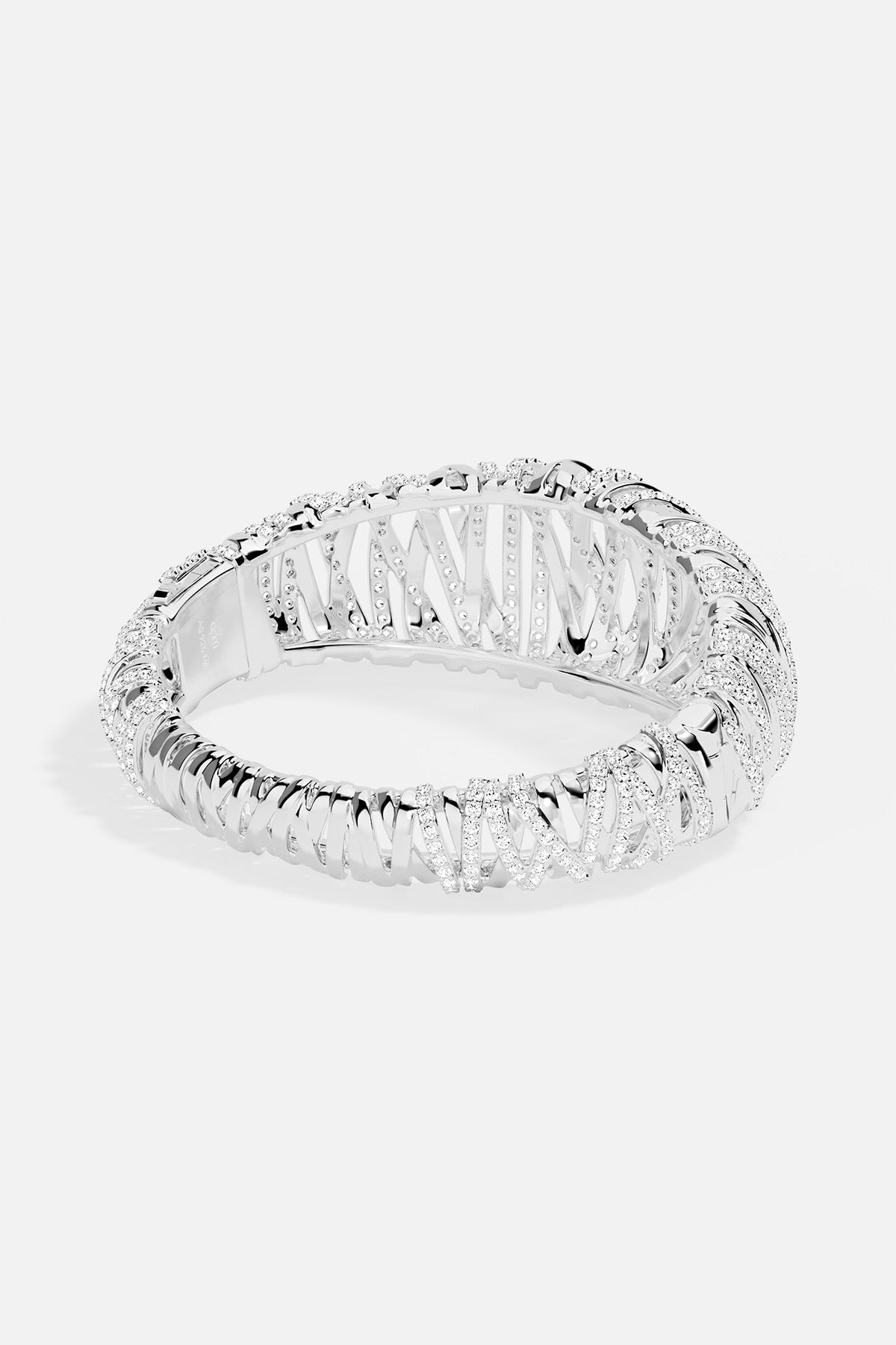 APM MONACO enlace bracelet in silver with clear white stones on a white background