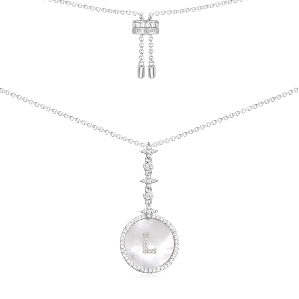 Necklaces APM Monaco, white-toned chain with a pavé letter L pendant encrusted with white stones.