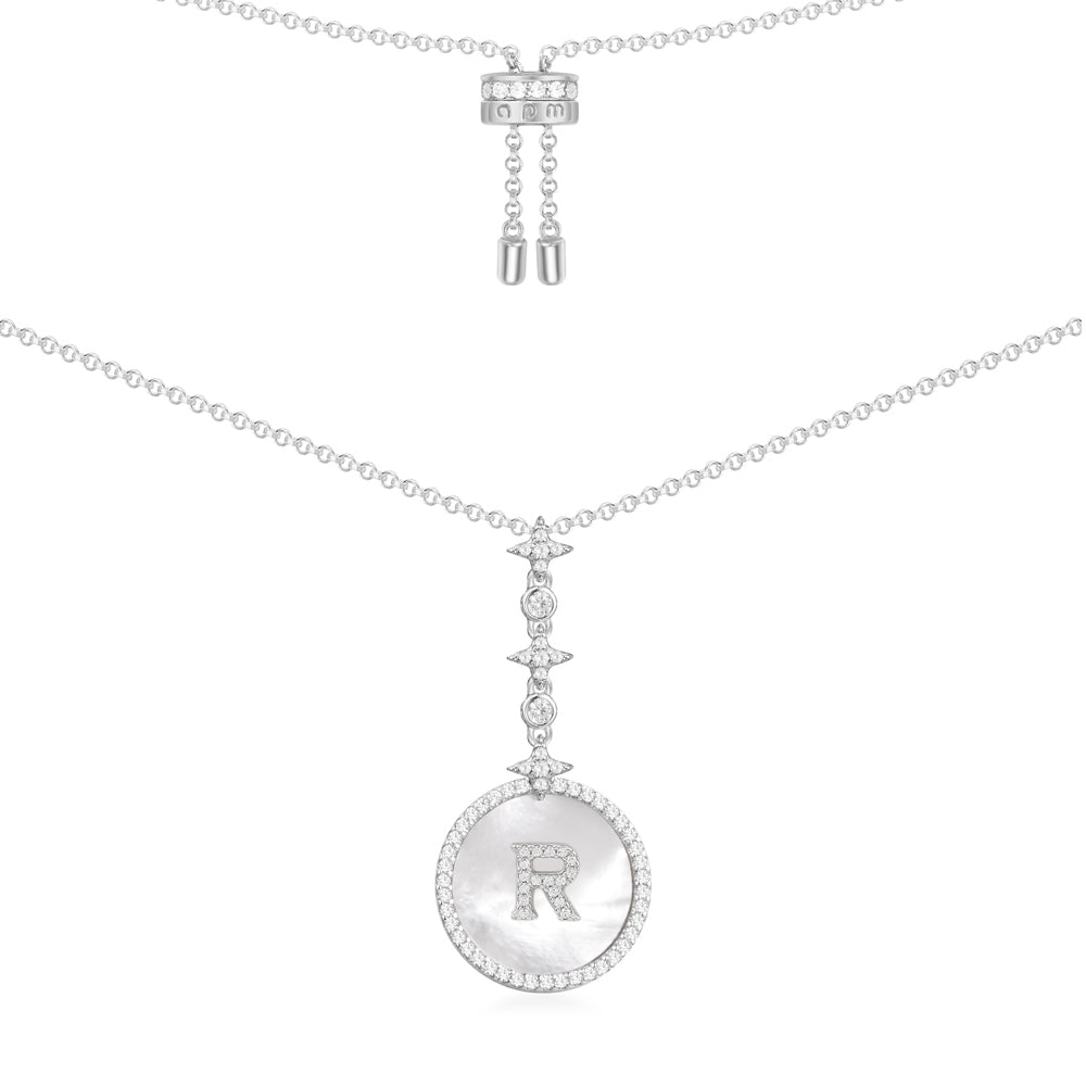 Necklaces APM Monaco white metal chain with a circular pendant featuring the letter R and a pave diamond edge.