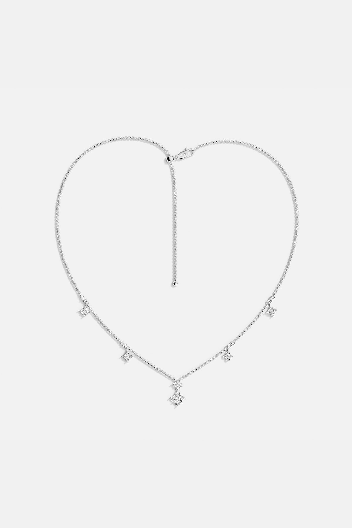 Necklaces APM Monaco adjustable spark necklace with a silver chain and White cubic zirconia pendant.