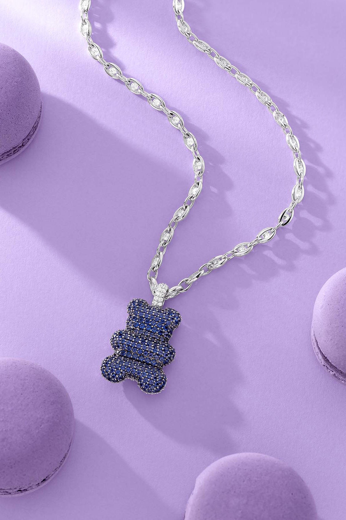 APM Monaco XL Baba Yummy Necklace on lilac background with macarons