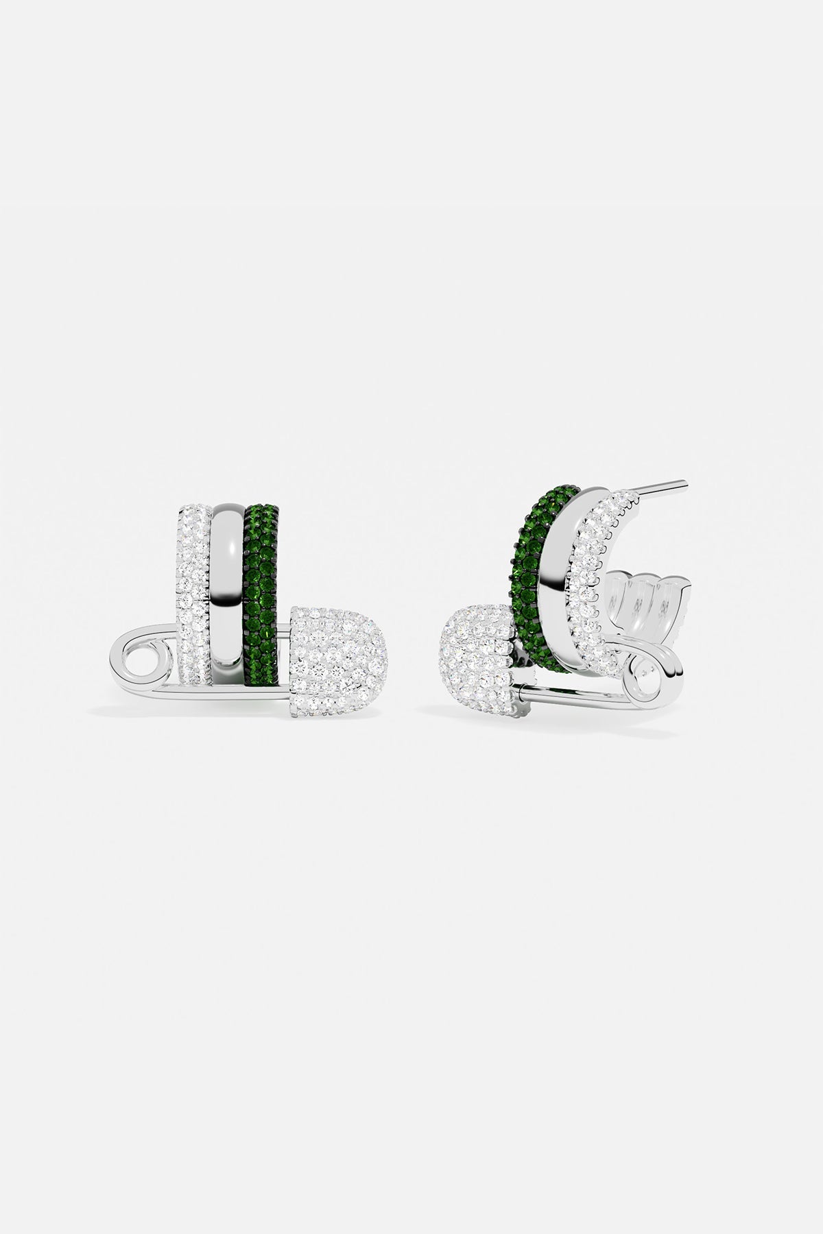 APM MONACO pair of silver earrings with green stones on a white background