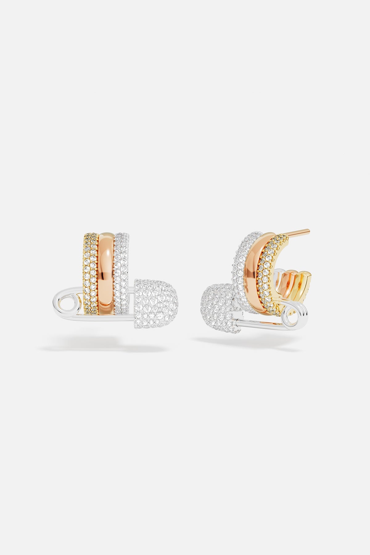 Earrings APM Monaco two safety-pin hoop earrings in rose gold and white gold with multicolor accents.