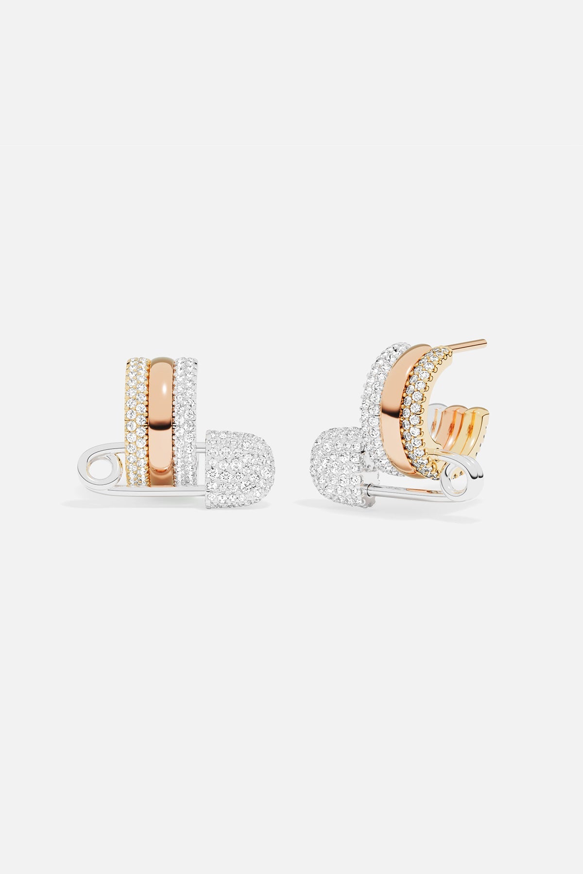 Earrings APM Monaco two safety-pin hoop earrings in rose gold and white gold with multicolor accents.