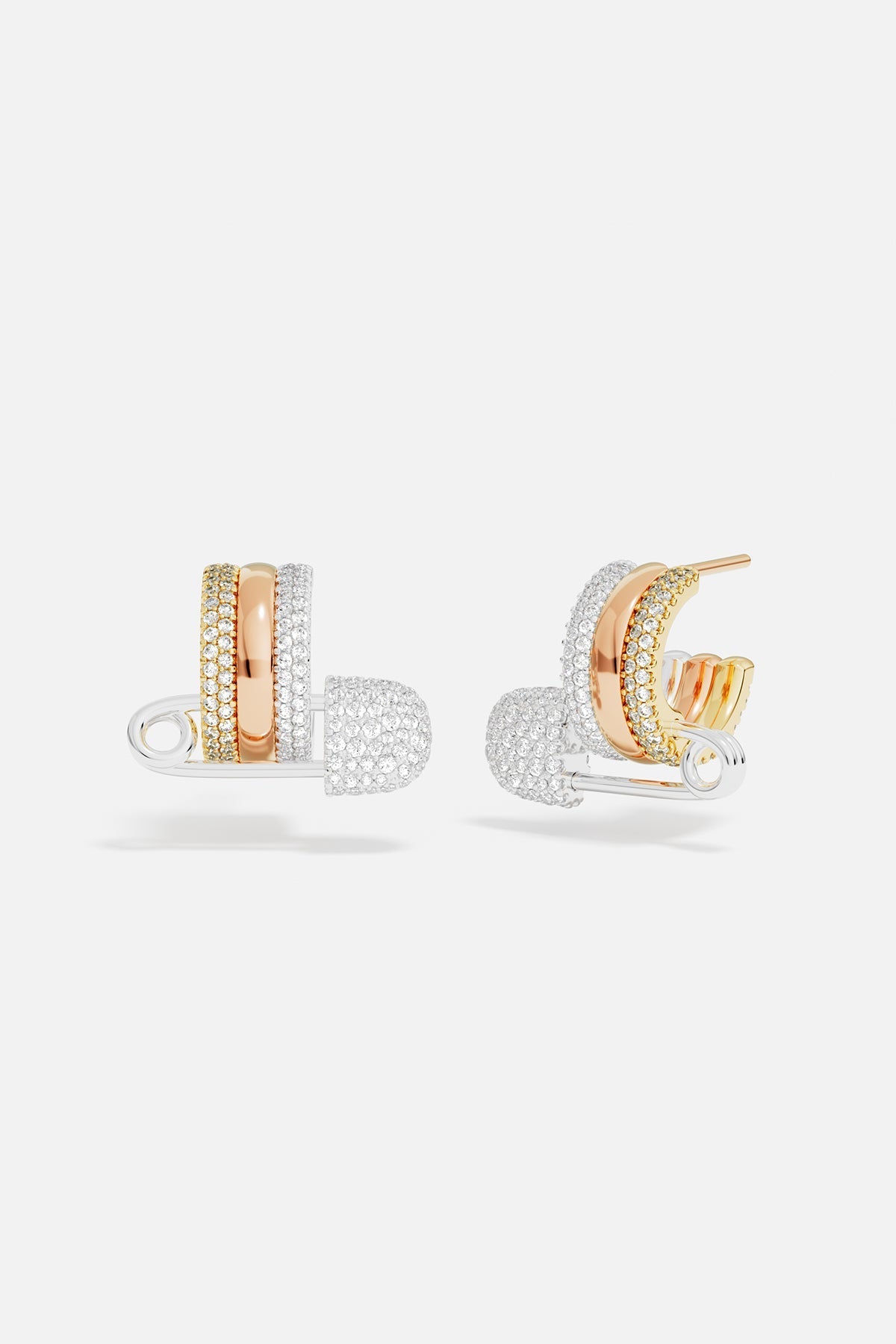 Earrings APM Monaco two safety-pin hoop earrings in rose gold and white gold with multicolor accents.