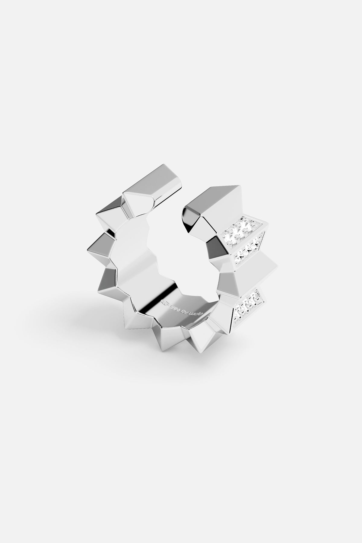 Single ear cuff with geometric design on a white background