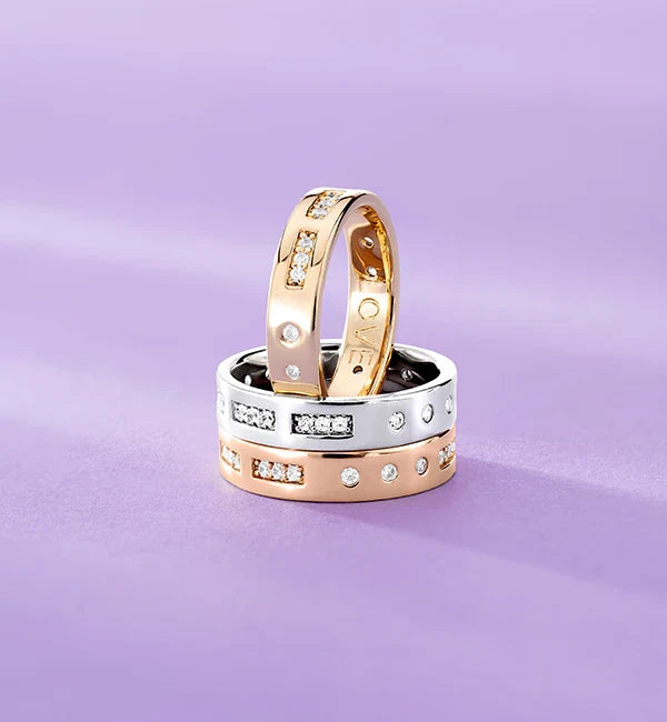 Three APM MONACO morse code rings on a purple background