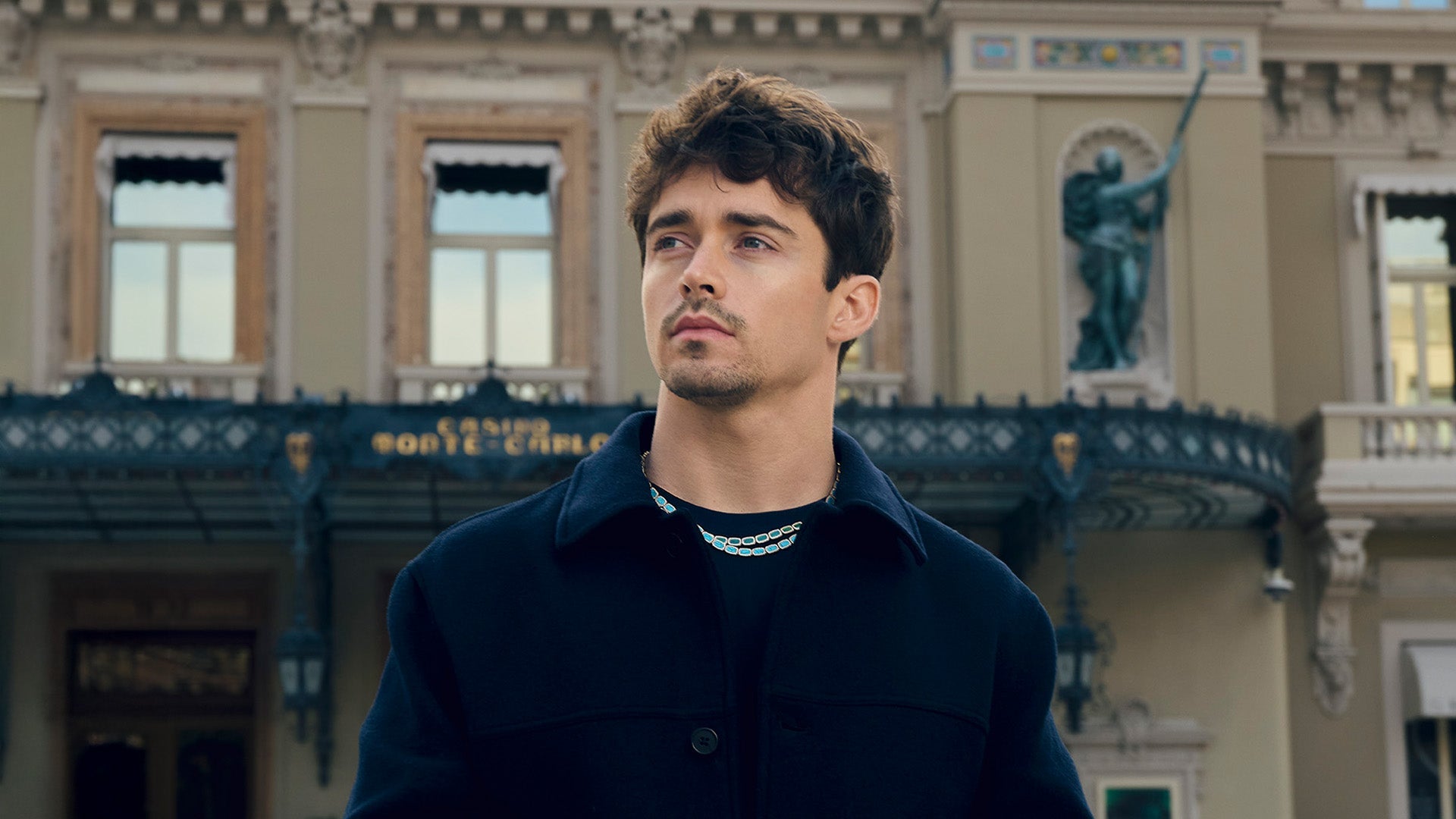 Man standing in front of a classical building with APM MONACO Mediterranee unisex jewelry