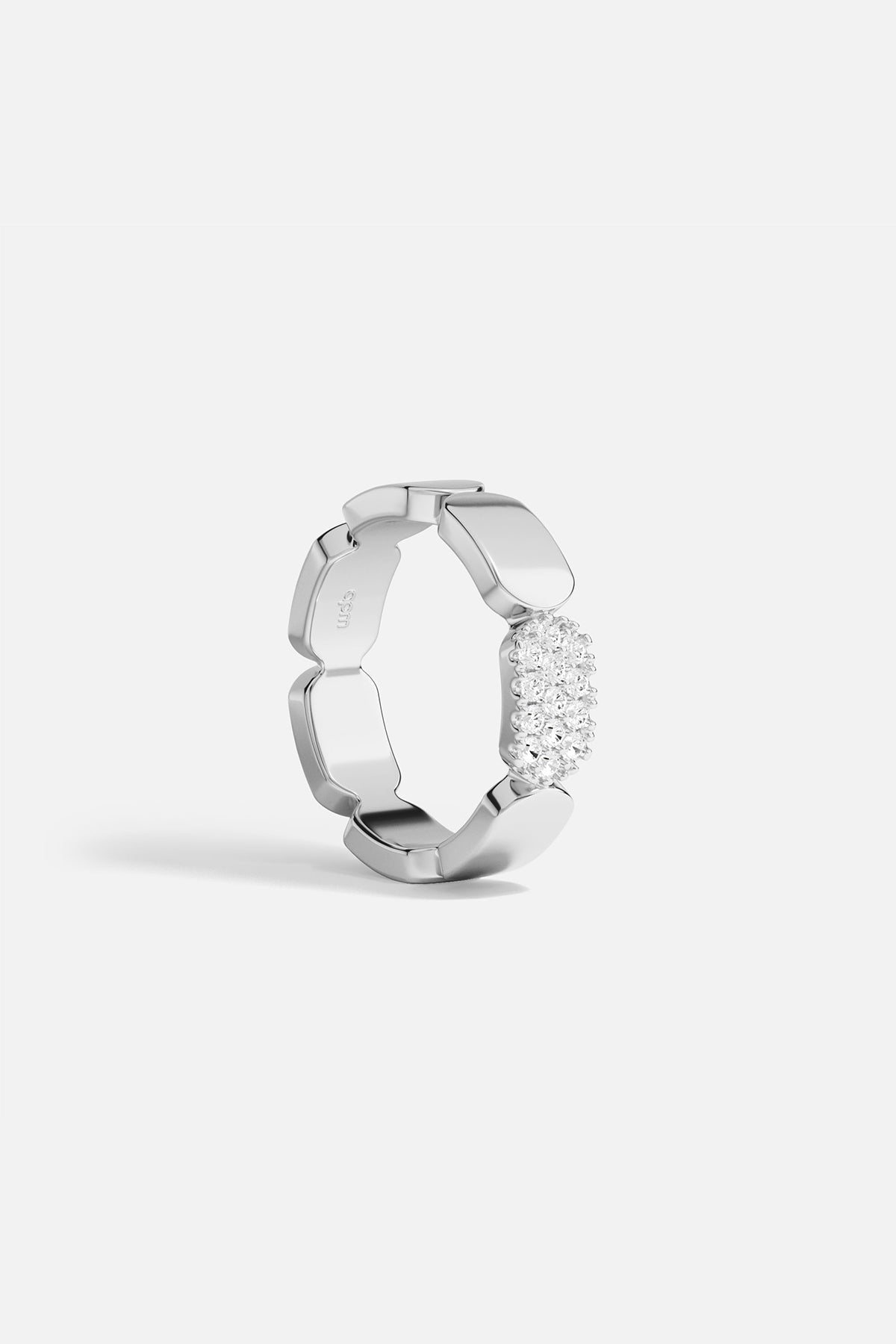 APM MONACO paved ring with white stones on white background