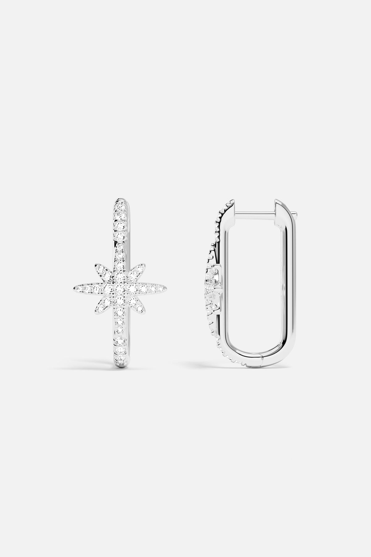 Earrings APM Monaco, silver-tone pair featuring a star-shaped and a U-shaped design.