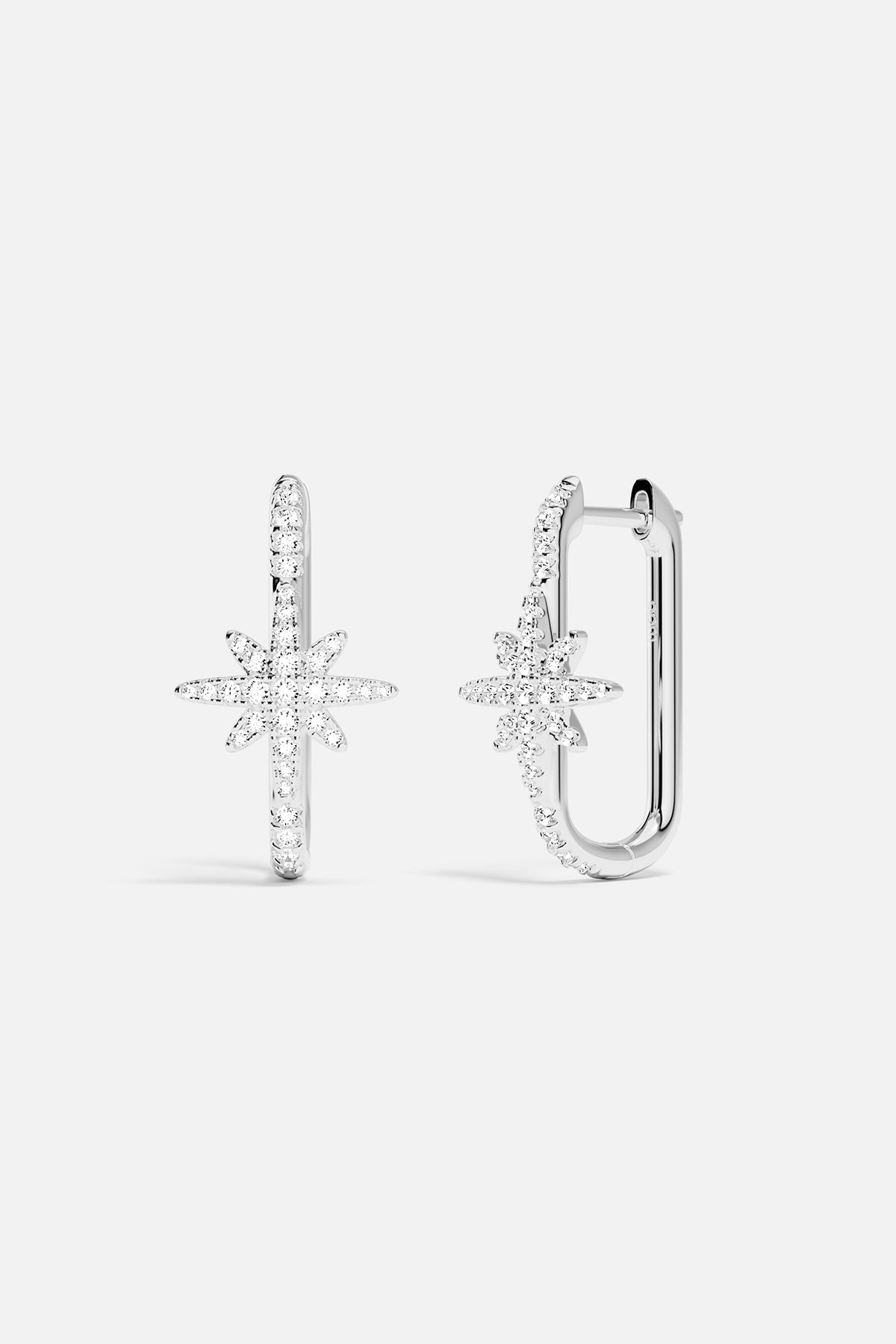 Earrings APM Monaco, silver-tone pair featuring a star-shaped and a U-shaped design.