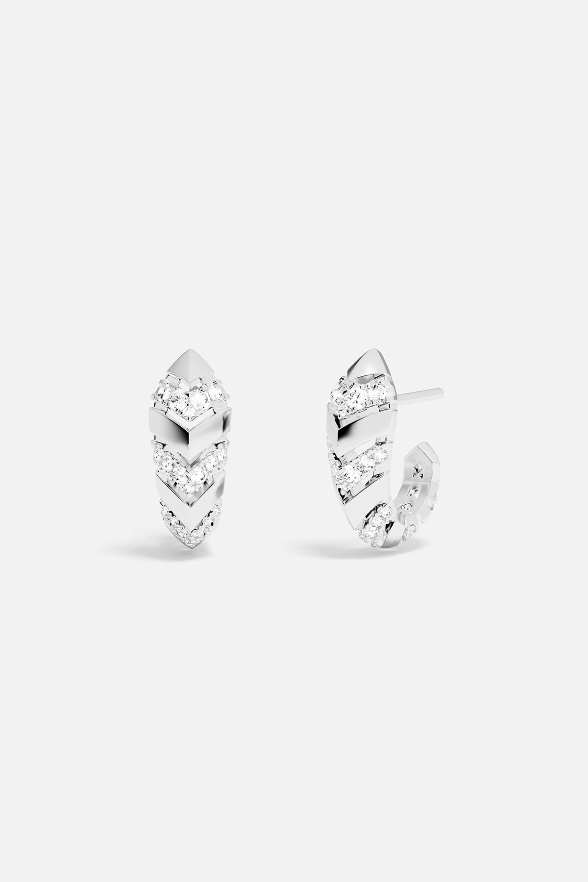 Pair of hoop earrings with white stones on a white background