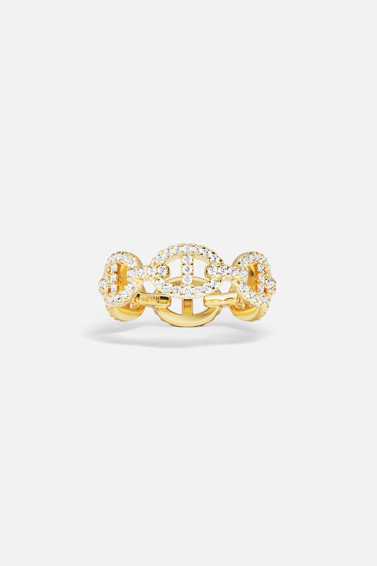 Gold ring with white cubic zirconia accents on a light gray background
